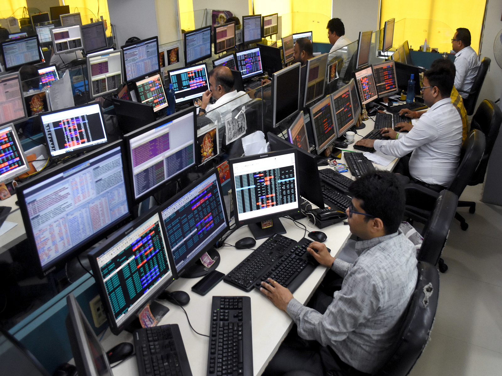 Shareholders and brokers monitor data during share trading (File Photo/ANI)