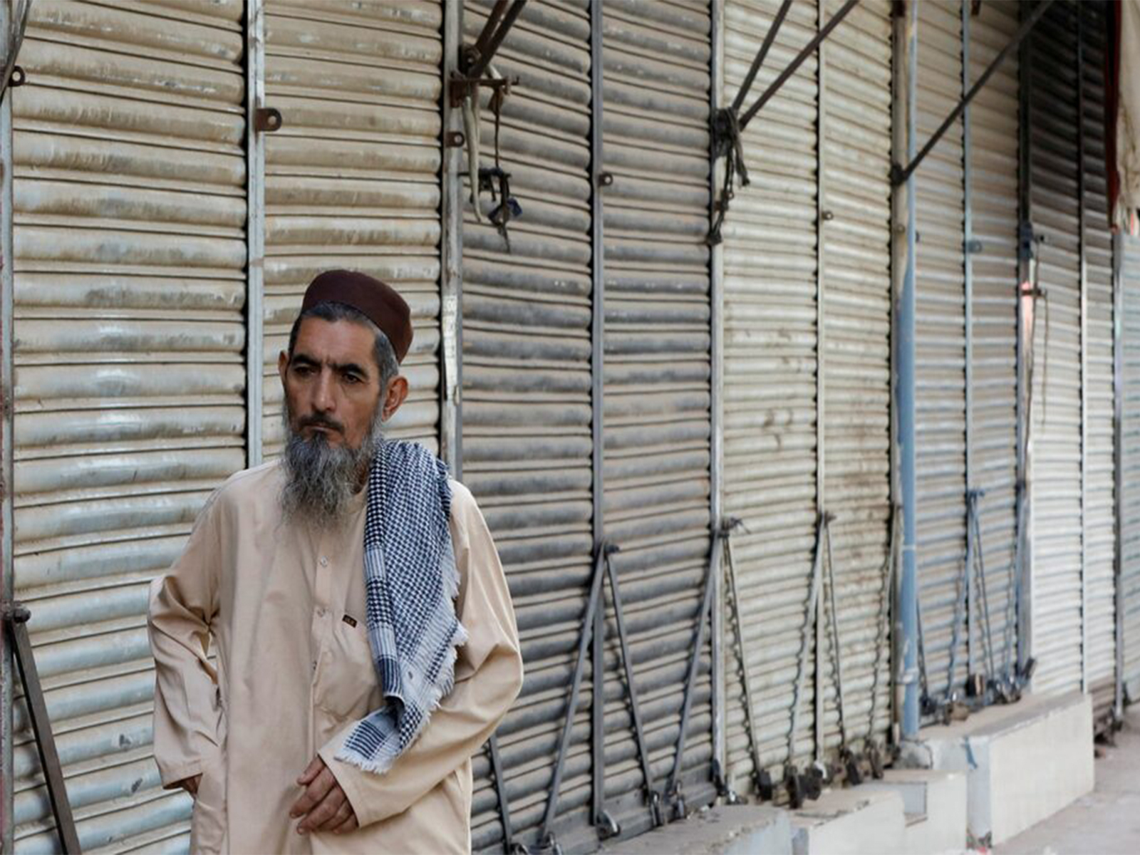 A man walks along closed market, during a shutter down and wheel-jam strike called by the traders (File Photo/ Reuters) A man walks along closed market, during a shutter down and wheel-jam strike called by the traders (File Photo/ Reuters)
