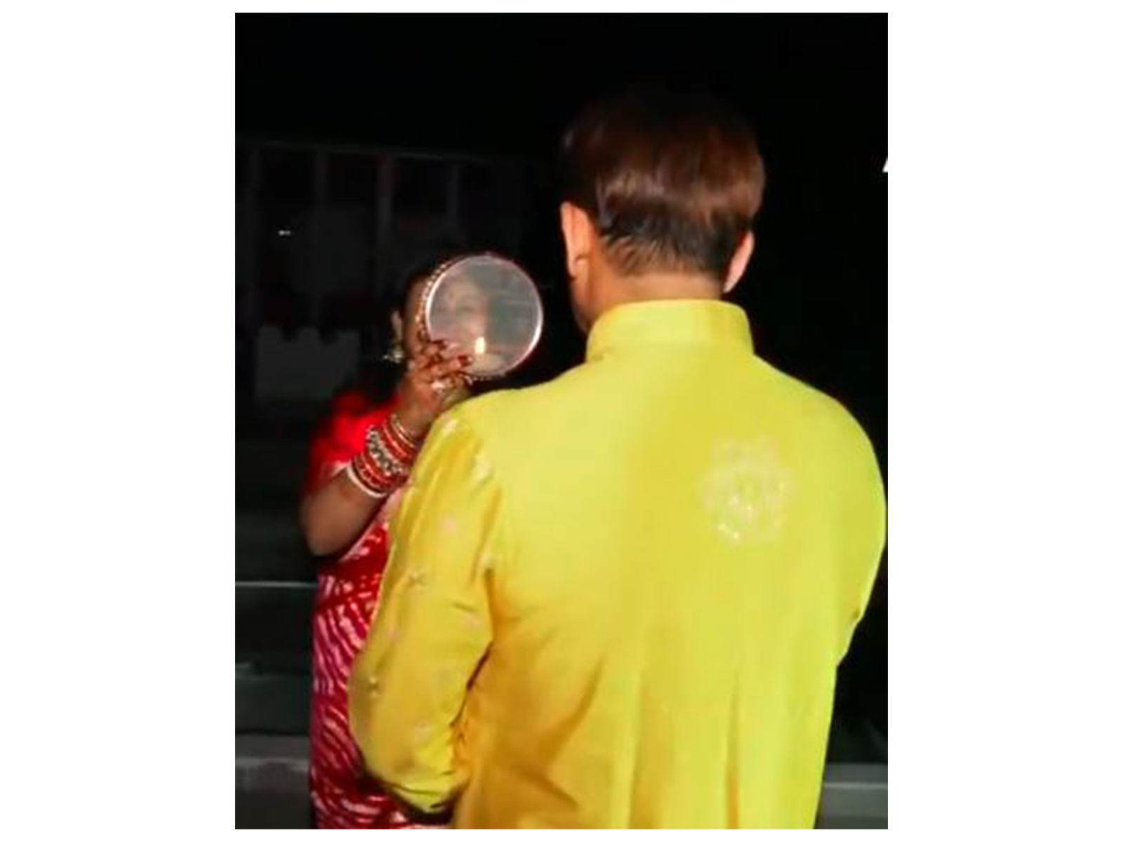 BJP MP Manoj Tiwari and his wife (Photo/ANI)