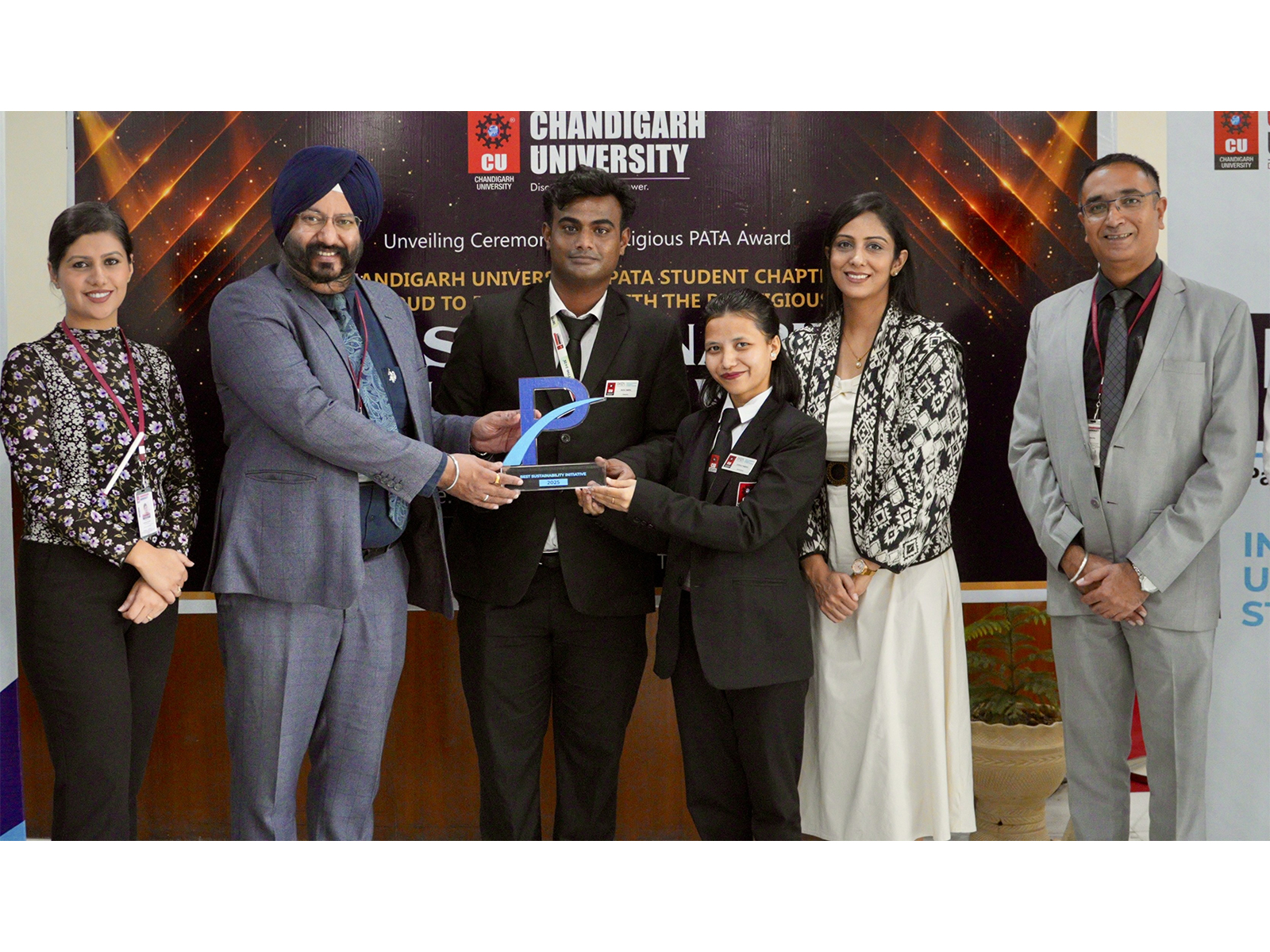Chandigarh University Registrar along with students after receiving Global PATA Award for Excellence in Sustainability & Social Responsibility at Gharuan campus
