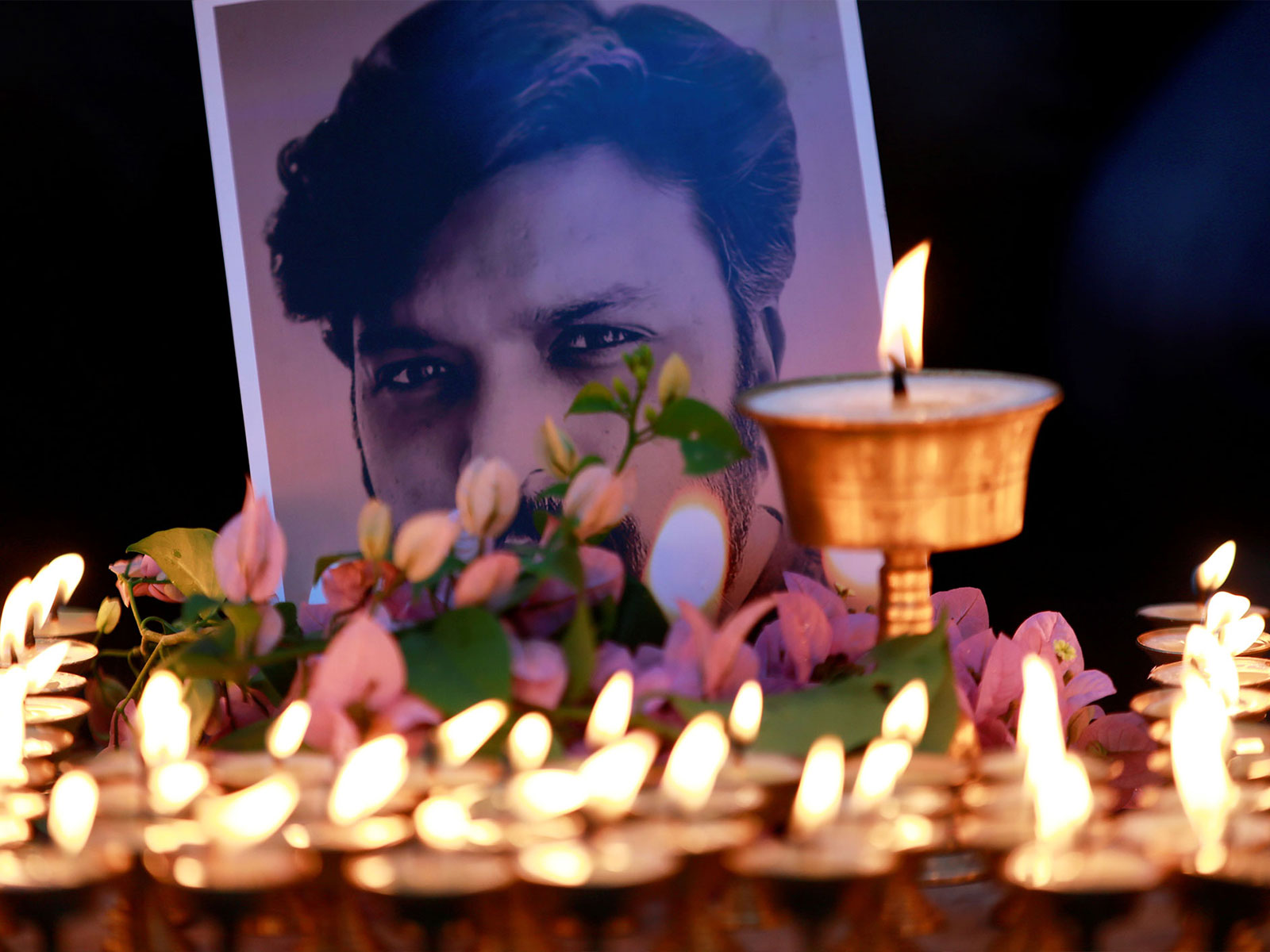 Butter lamps in honour of Reuters journalist Danish Siddiqui (Photo/Reuters) Butter lamps in honour of Reuters journalist Danish Siddiqui (Photo/Reuters)