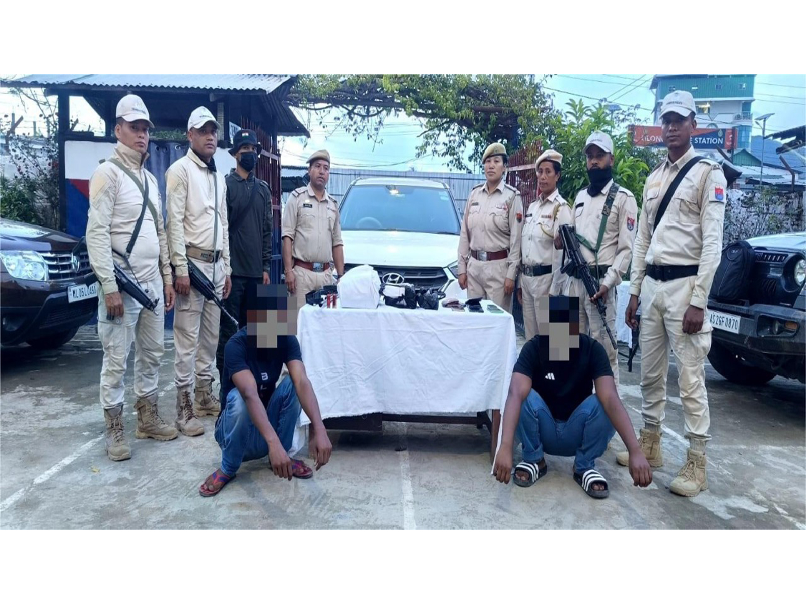Police personnel with two alleged drug peddlers in Manipur (Photo: @manipur_police/X)