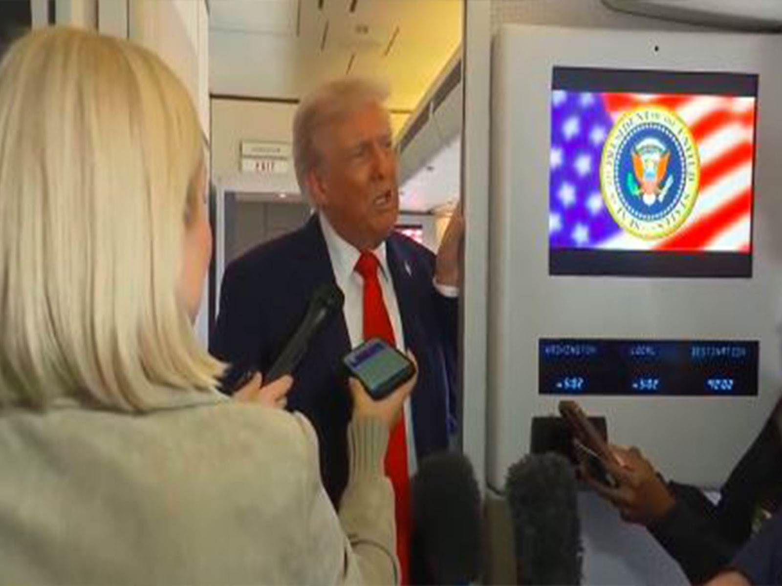 US President Donald Trump speaks to reporters aboard Air Force One (Photo/Reuters)