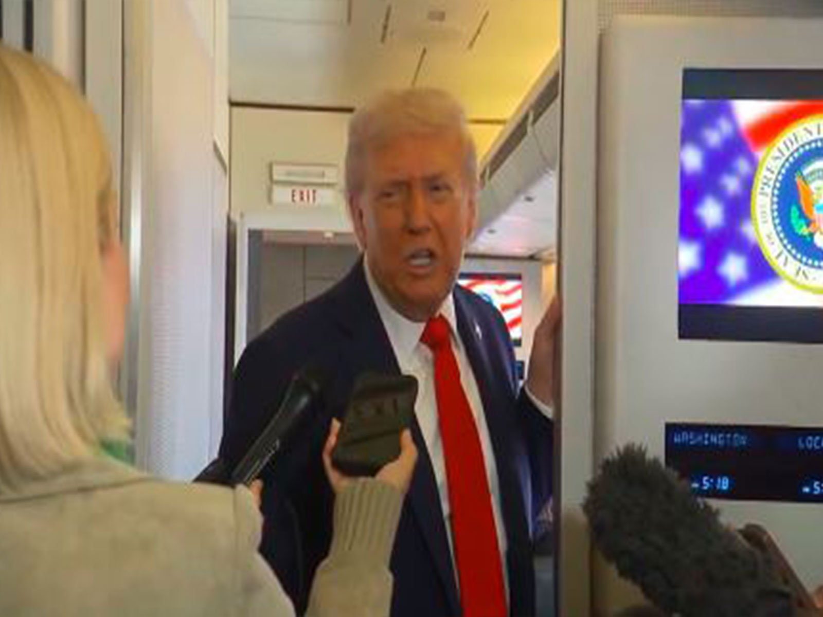 US President Donald Trump speaks to reporters aboard Air Force One en route to Israel (Image Source: The White House)