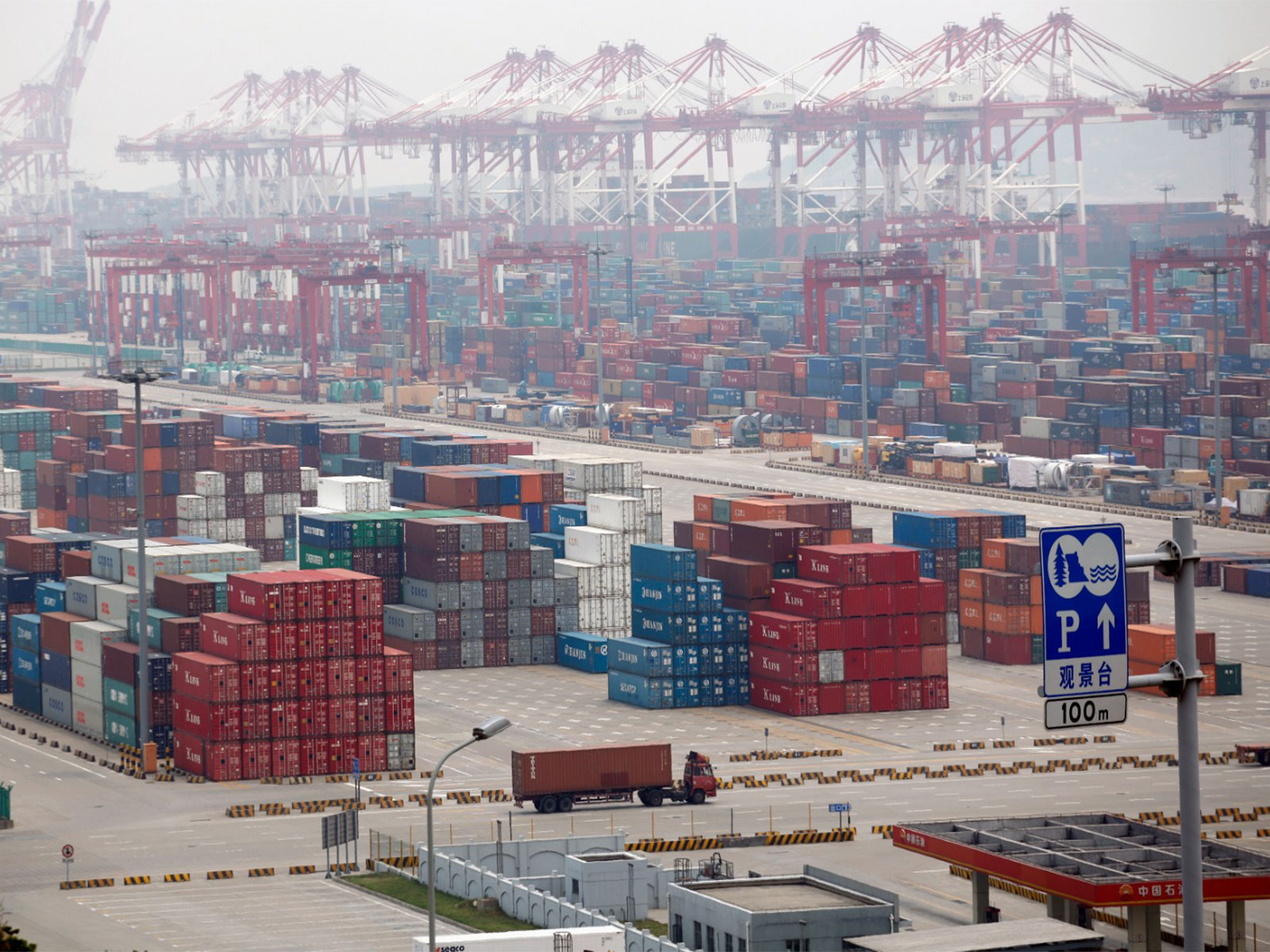 A container area is seen at the Yangshan Deep Water Port, south of Shanghai (Photo/Reuters)