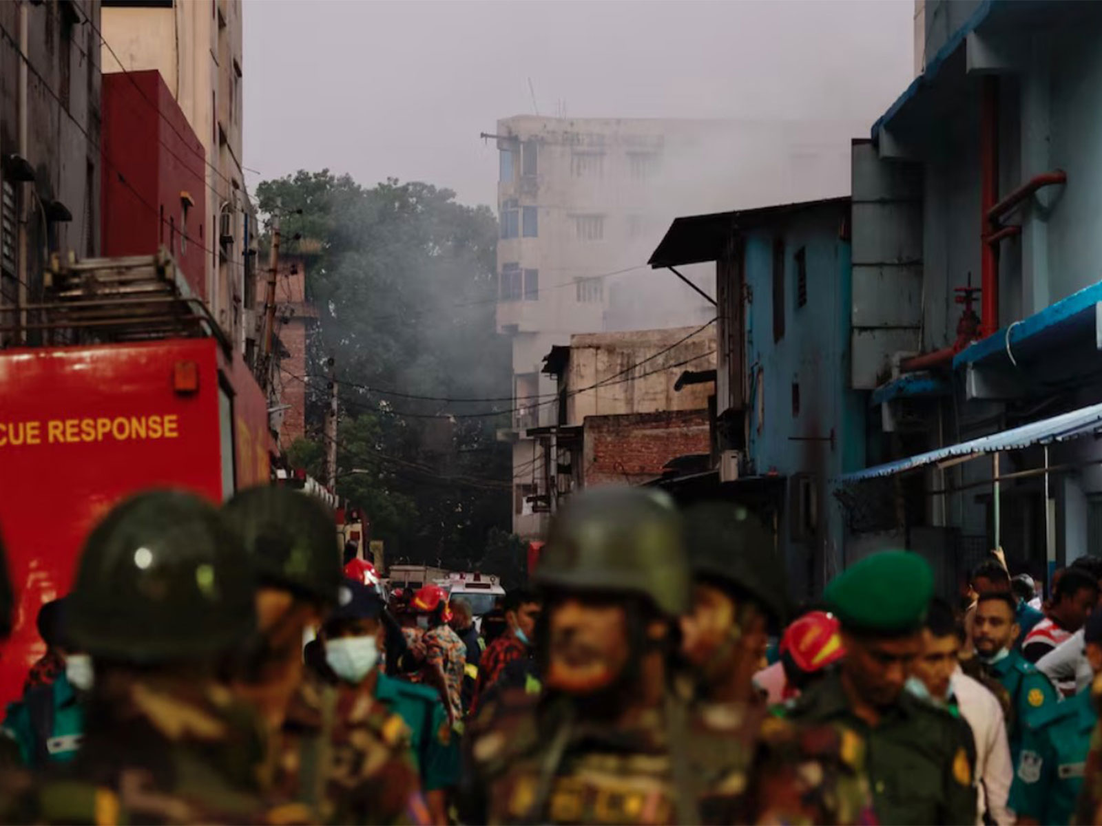 Smoke rises from a building as fire broke out at a garment factory and a chemical warehouse in Dhaka (Photo/Reuters)