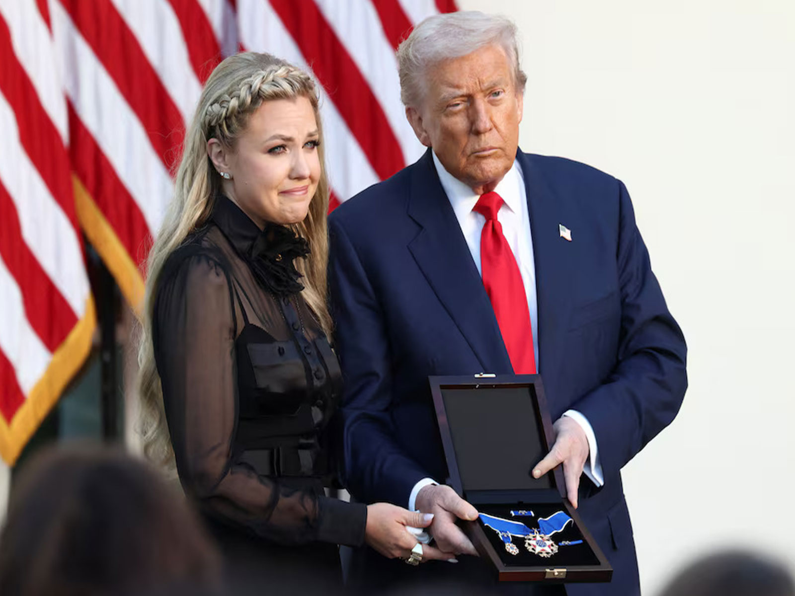 US President Donald Trump presents the Presidential Medal of Freedom to Erika Kirk during a ceremony at the White House. (Photo/Reuters)
