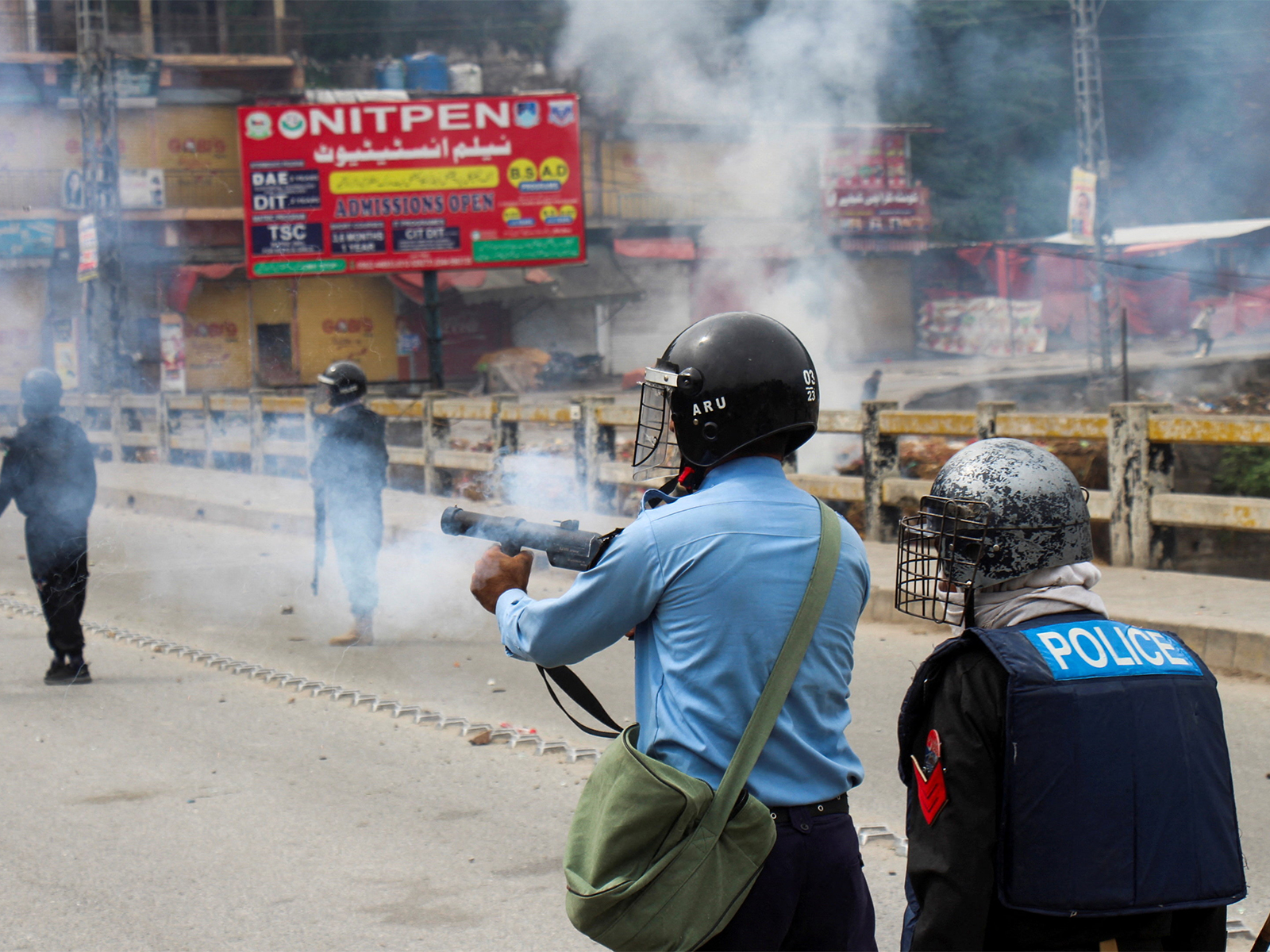 File photo of police firing teargas on protestors in PoJK (Photo/ Reuters)