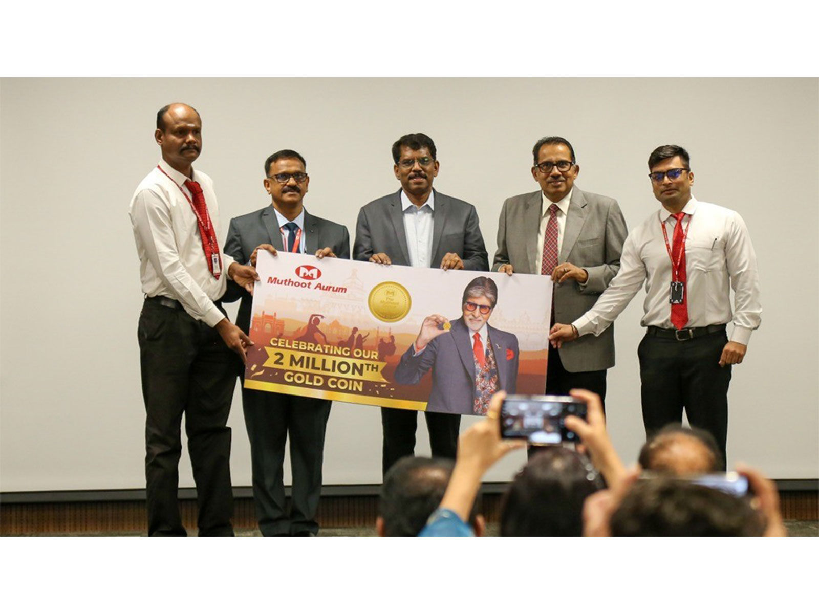 Muthoot Aurum CEO Andrew P X and team jointly presented a commemorative coin to George Alexander Muthoot, MD, The Muthoot Group