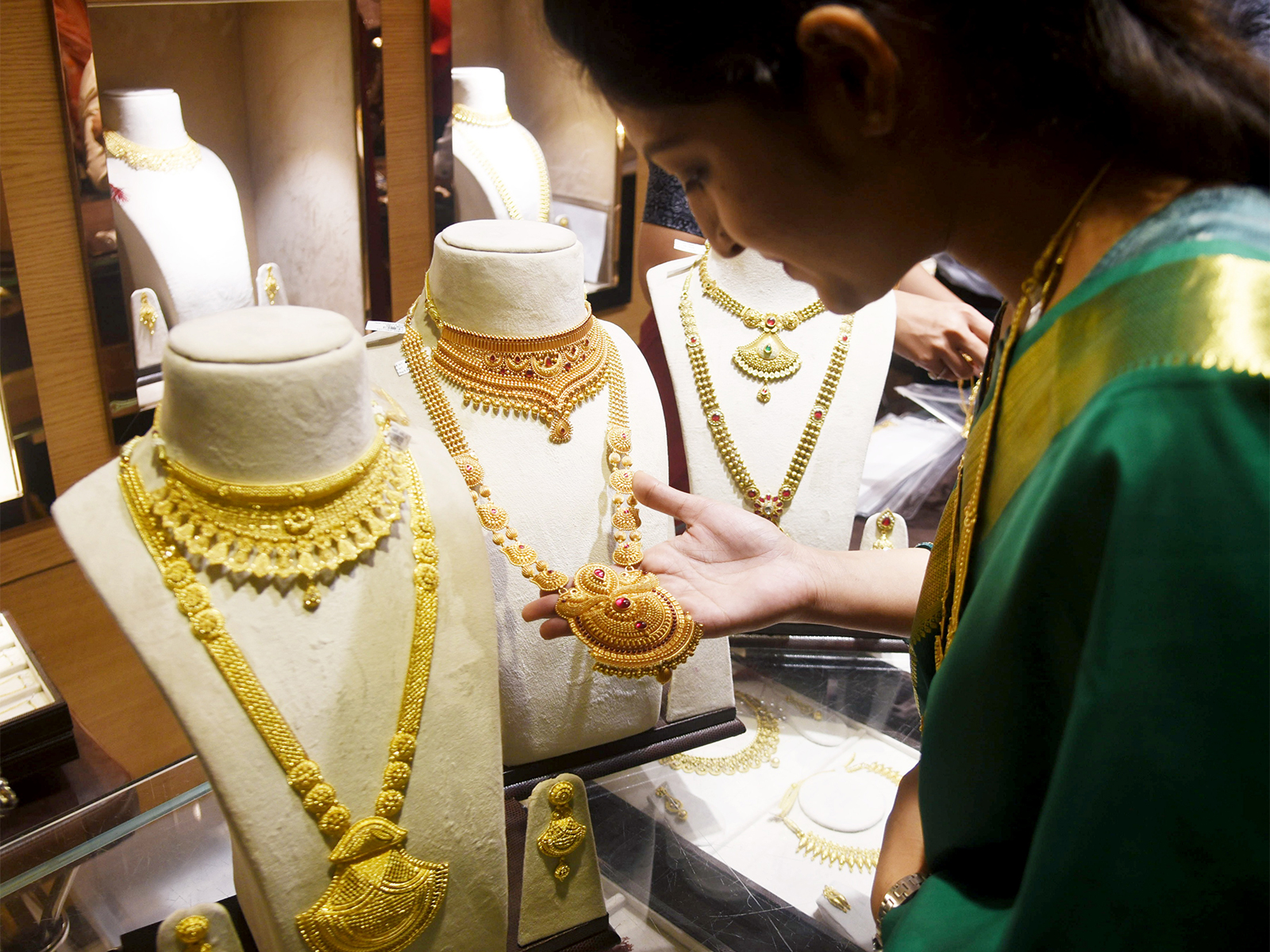 A woman shops for Gold jewellery on the occasion of Dhanteras festival (Photo/ANI)