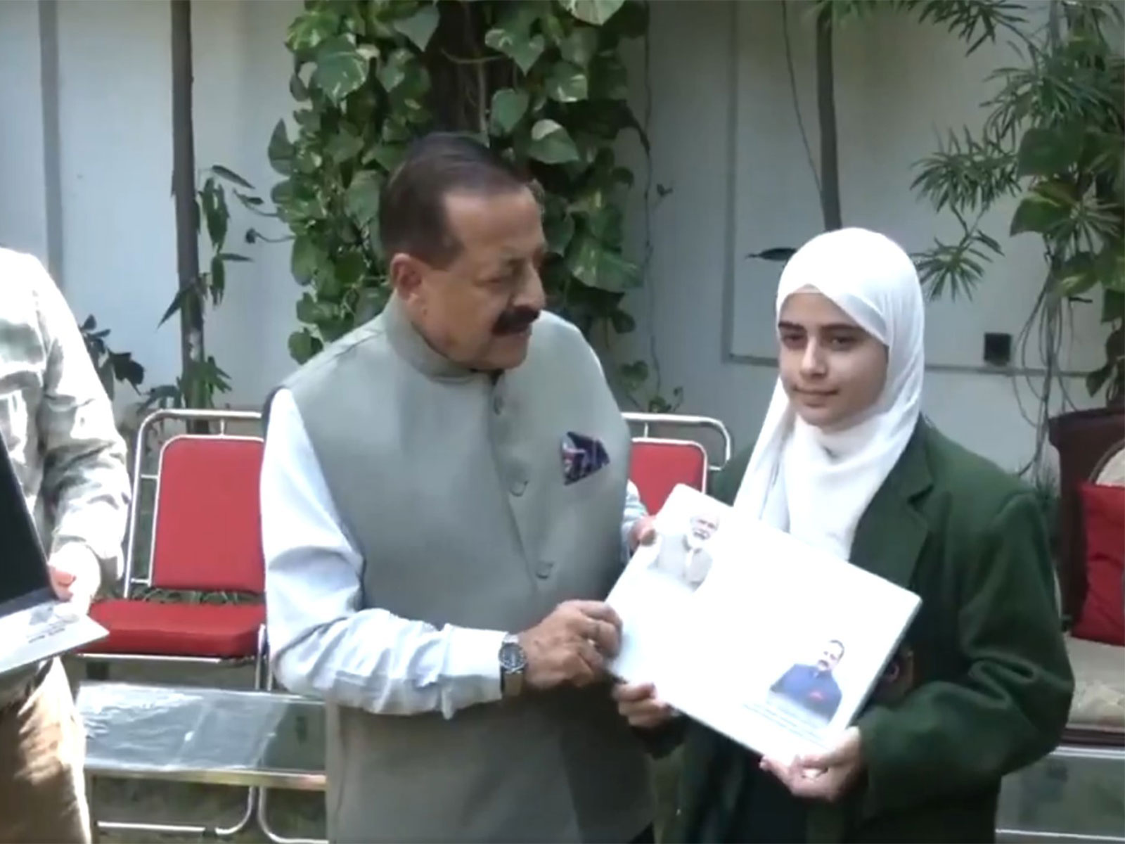 Dr Jitendra Singh distributing free laptops to top-performing female students. (Photo/ANI)