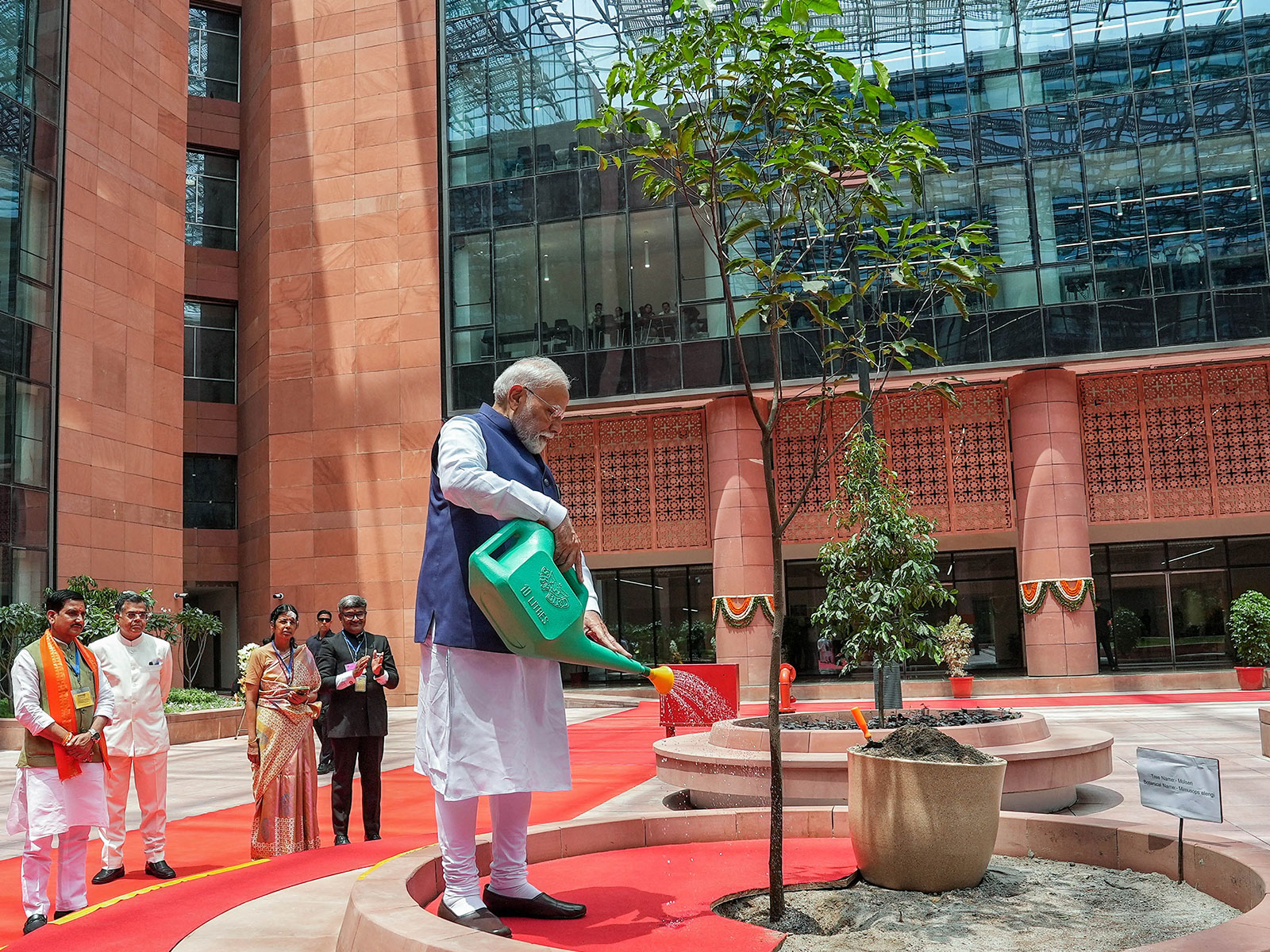 Prime Minister Narendra Modi plants a tree on the premises of the Kartavya Bhavan (File Photo/ANI)