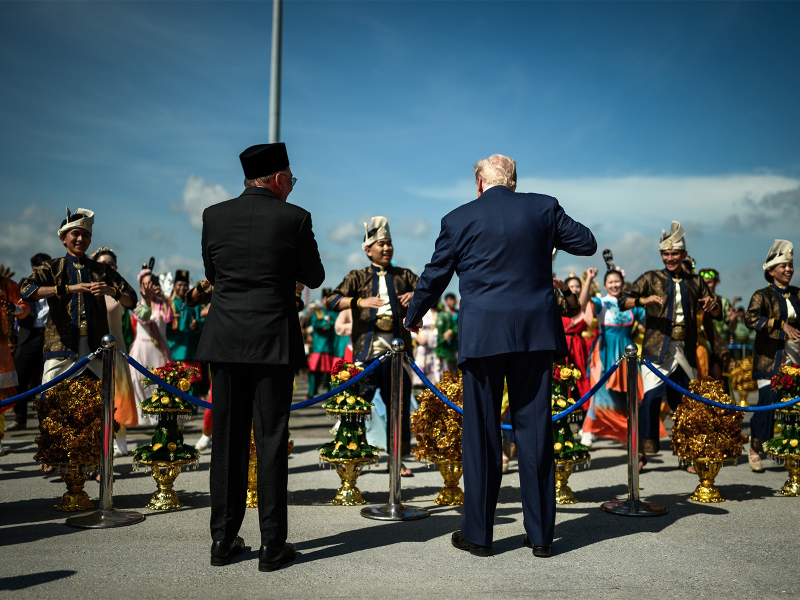US President Donald Trump dances to drums with Malaysian PM Anwar and performers in traditional costumes at Kuala Lumpur airport. (Photo/X/@WhiteHouse)
