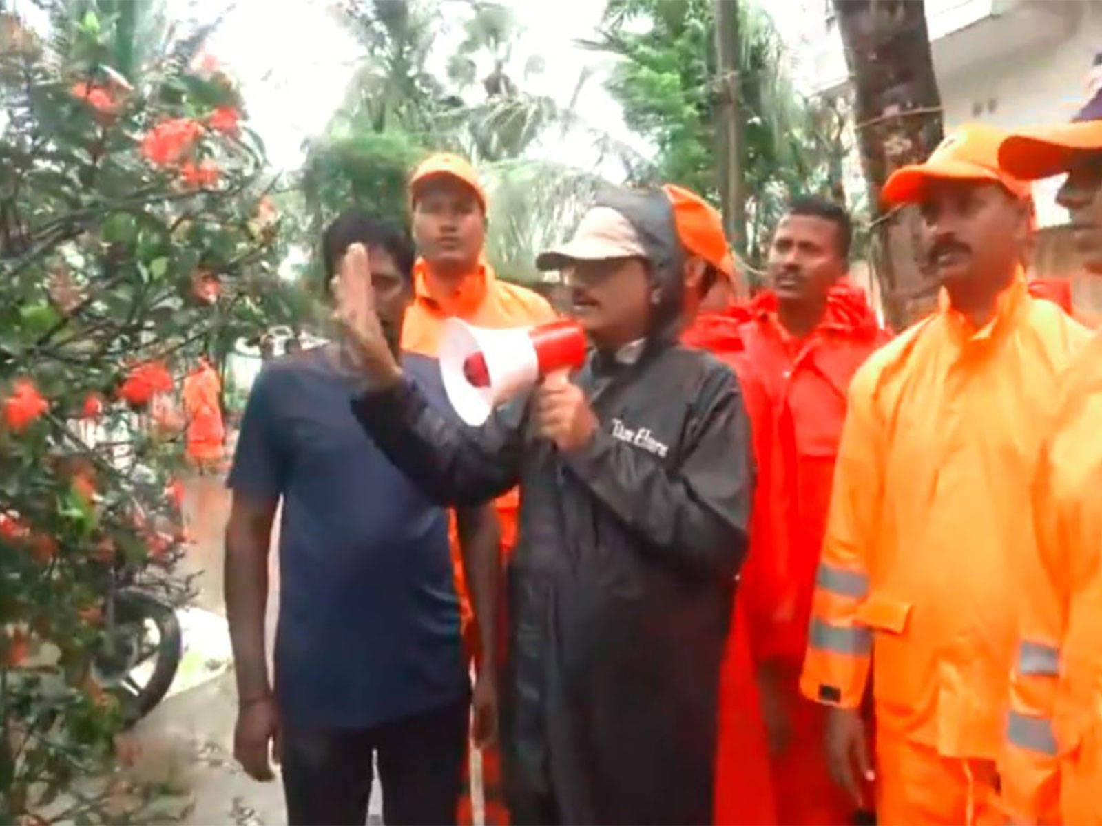 Officials make announcements and ask people to vacate their houses in AP's Kothapatnam village (Photo/ANI)