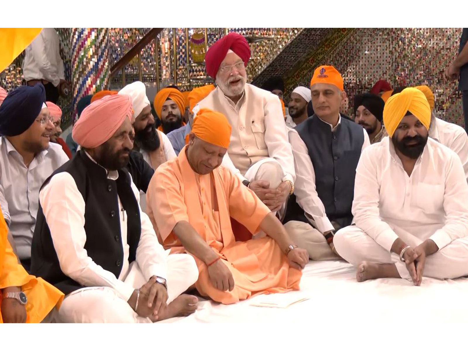 Uttar Pradesh CM Yogi Adityanath, along with Union Minister Hardeep Singh Puri, attends welcoming of the Holy Jore Sahib (Photo/ANI)