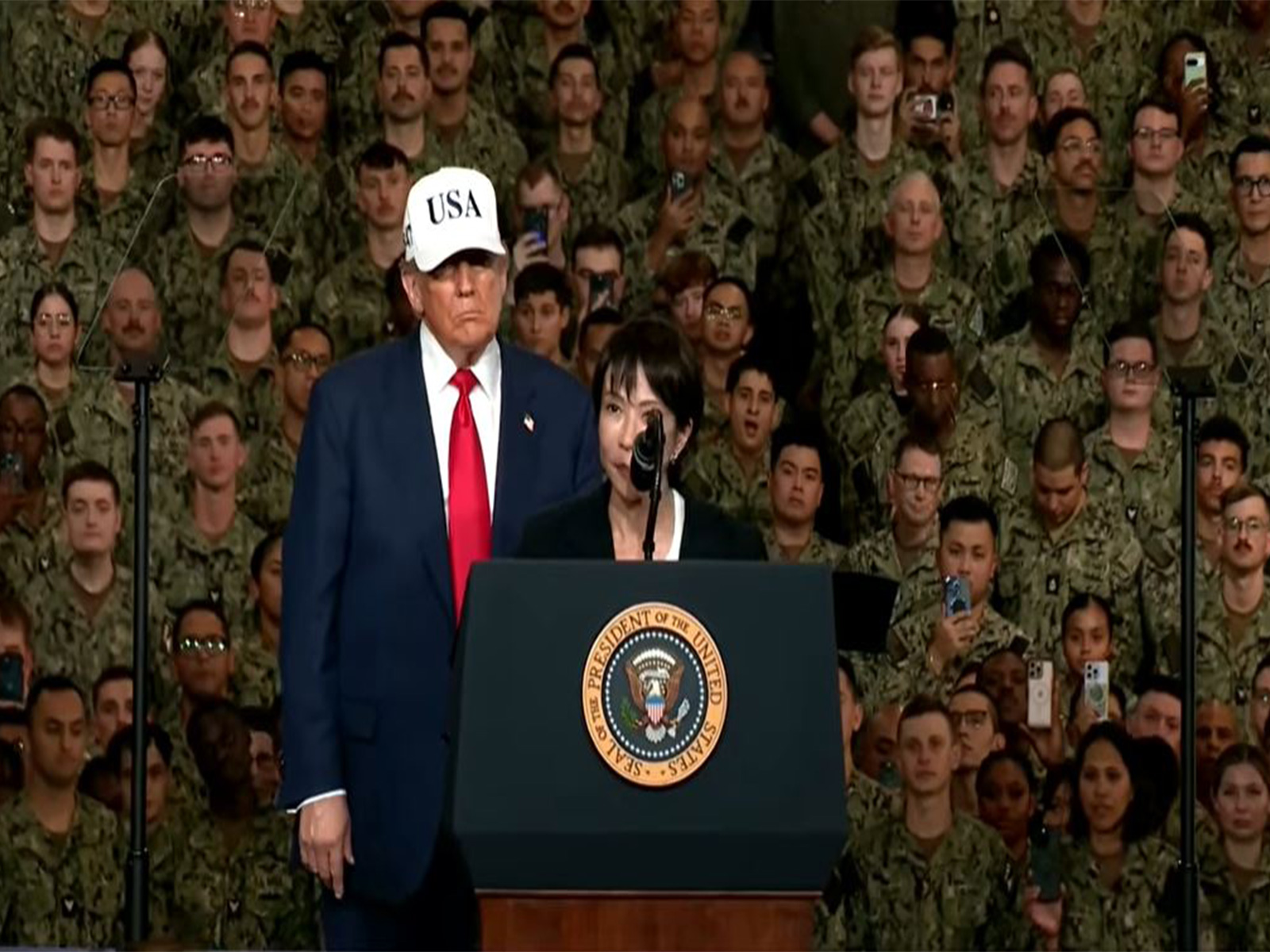 Japanese Prime Minister Sanae Takaichi addresses US troops aboard the USS George Washington at Yokosuka Naval Base. (Image Source: The White House/YouTube)