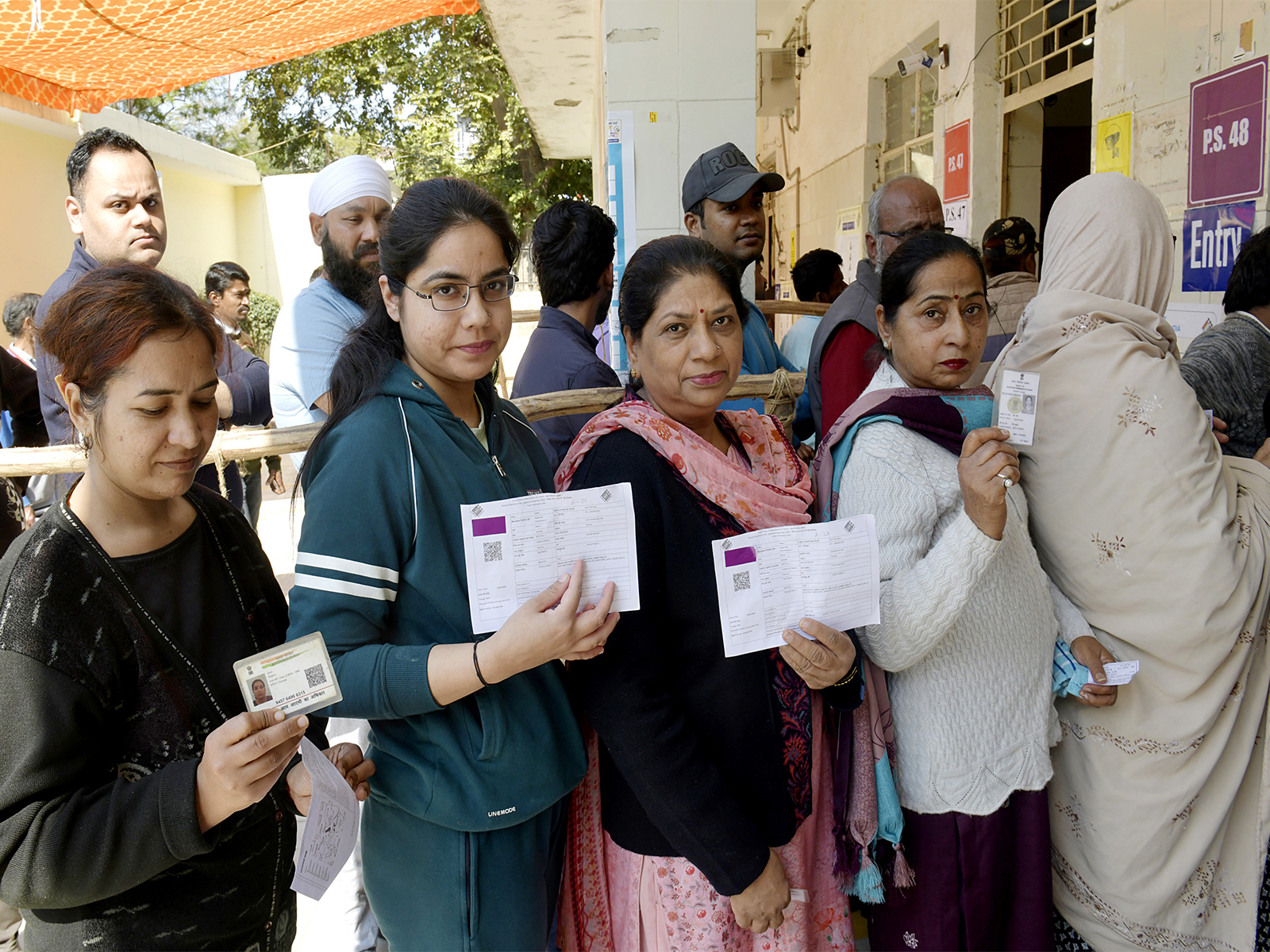 Electors queing up to vote with their ID (Photo/ANI)