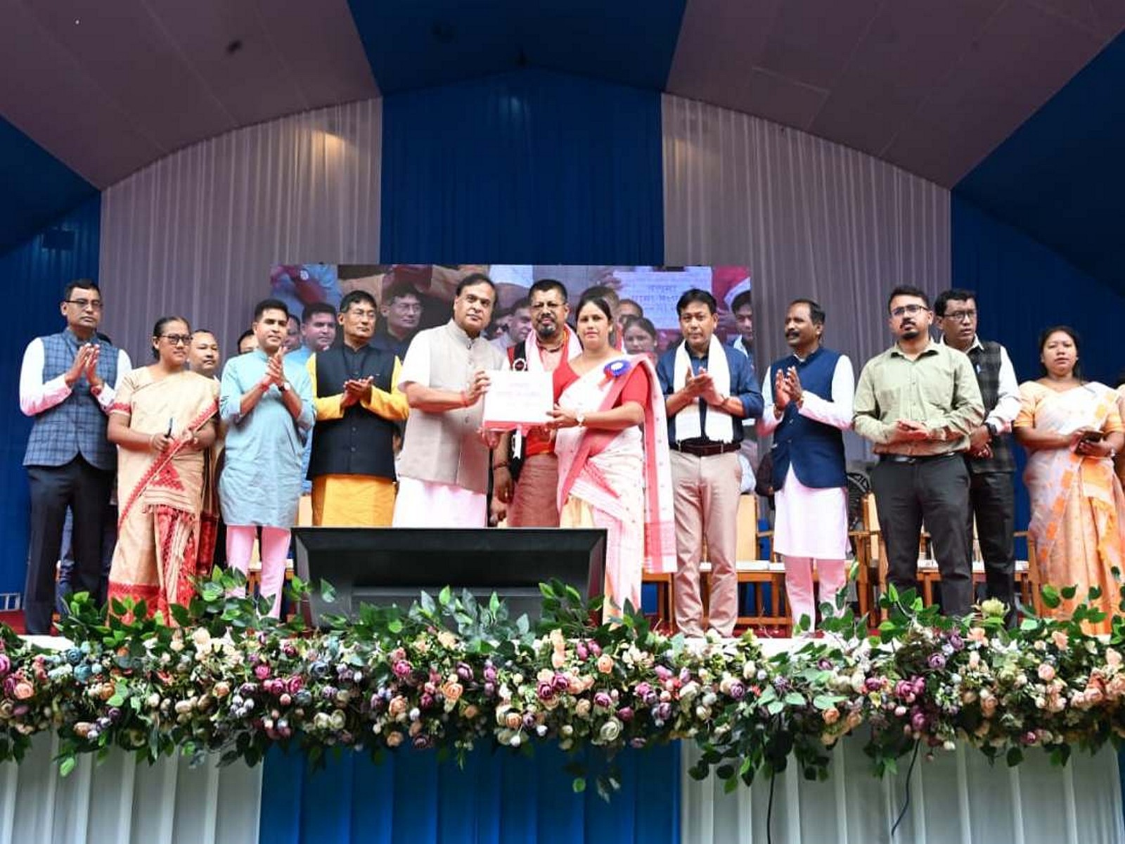 Assam Chief Minister Himanta Biswa Sarma presents cheques to beneficaries (Photo/ANI)