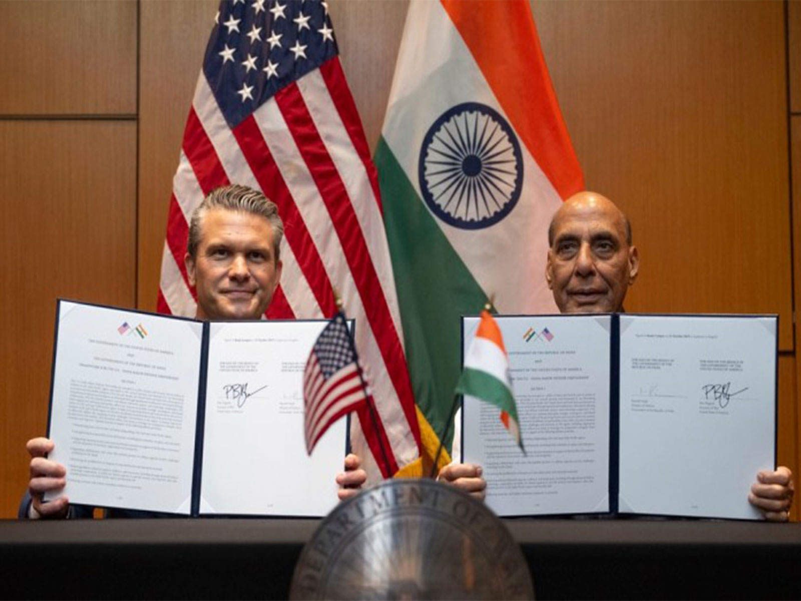 Defence Minister Rajnath Singh and US Secretary of War Pete Hegseth exchange the 10-year Defence Framework Agreement in Kuala Lumpur. (Photo: X/@SecWar)