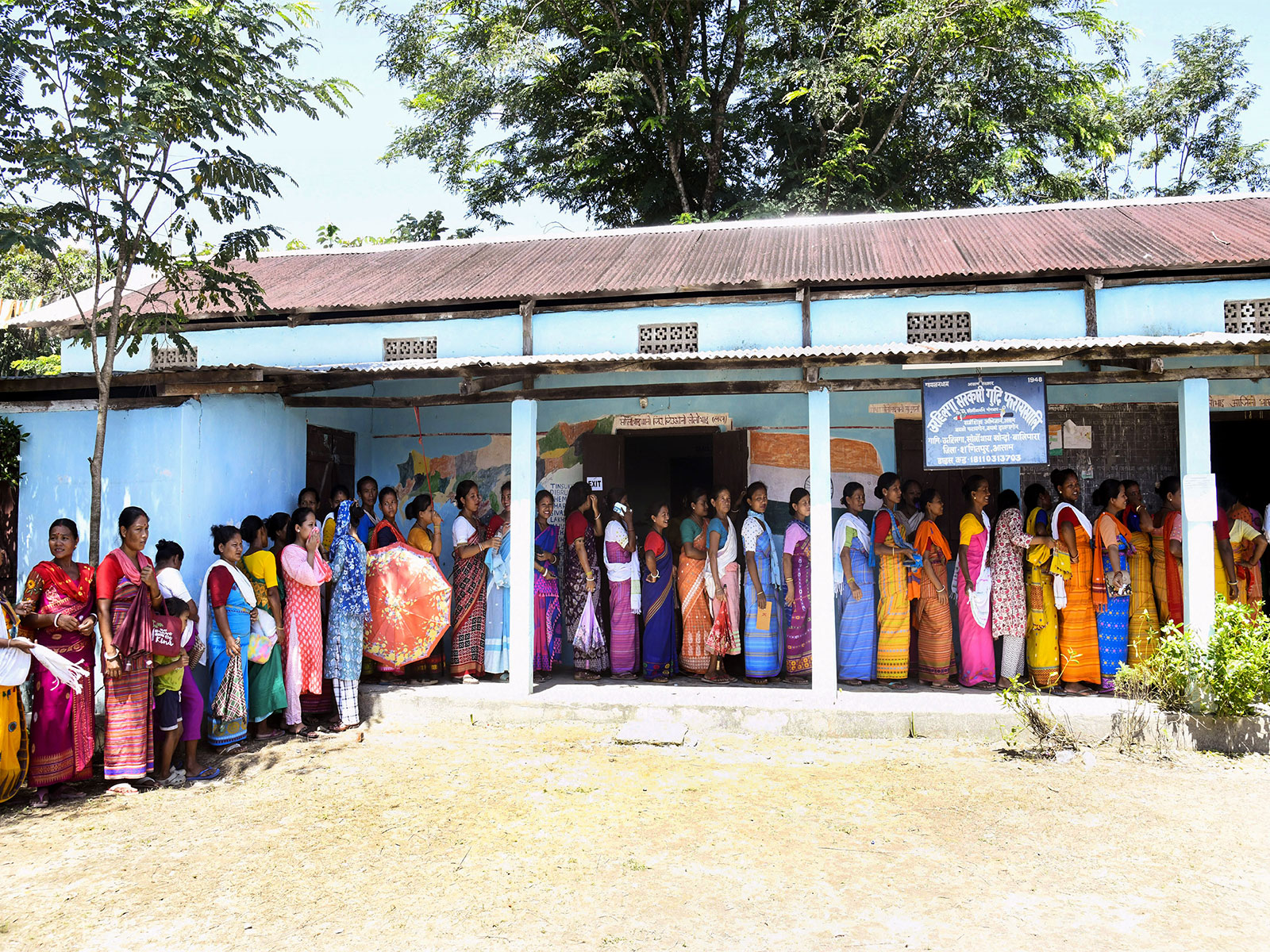 Voters queing up to cast their vote in the polling booth (Photo/ANI)