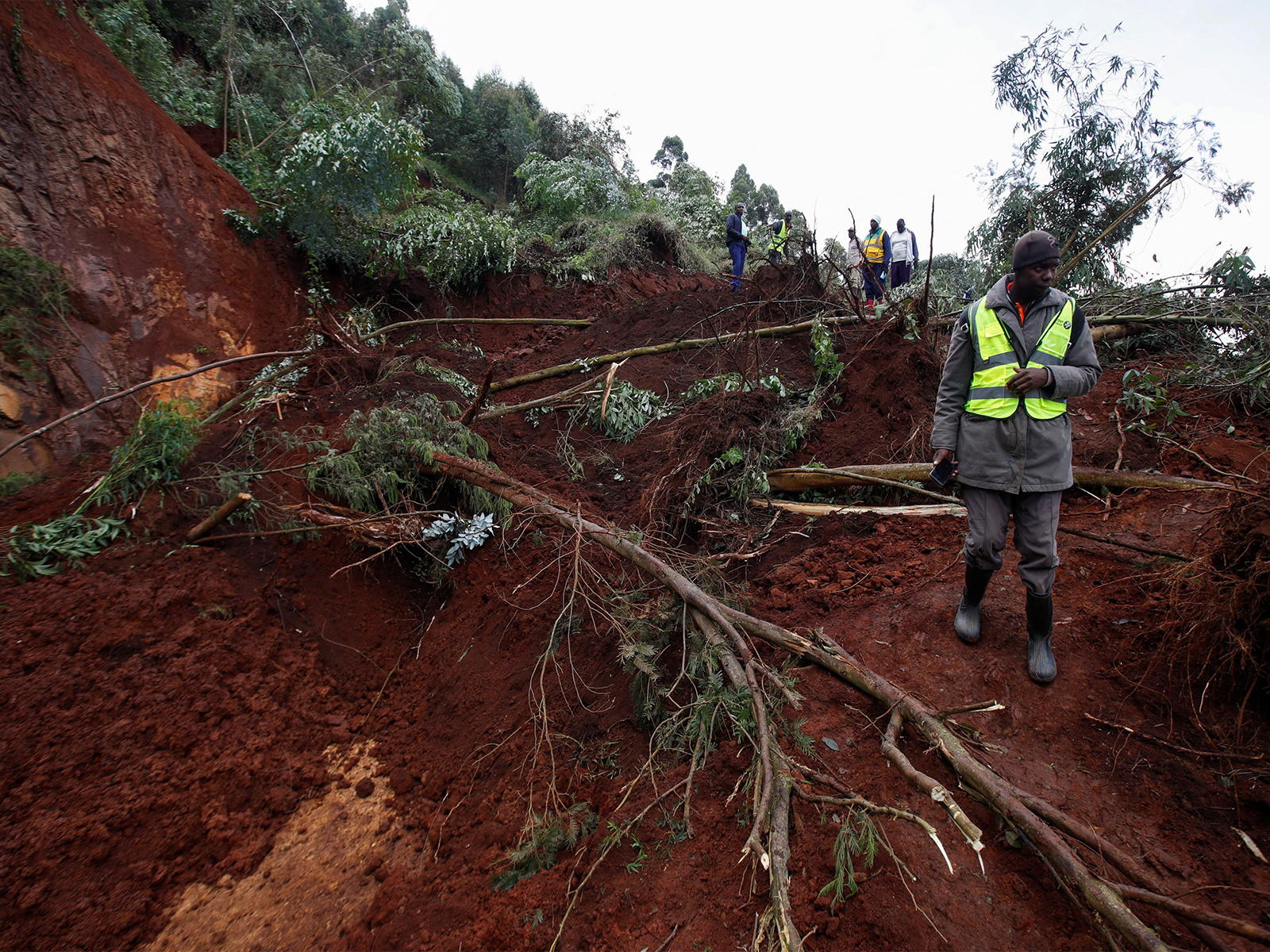 Residents search for people feared trapped after a landslide triggered by heavy rains in the Matathia area of Kimende Escarpment, Kiambu County, Kenya. (File Photo/Reuters)