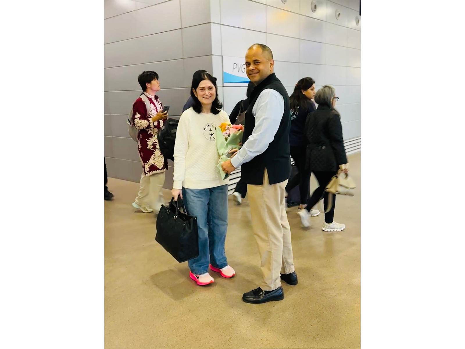 CG Pratik Mathur welcomes passengers in Shanghai (Photo:X/@IndiaInShanghai)
