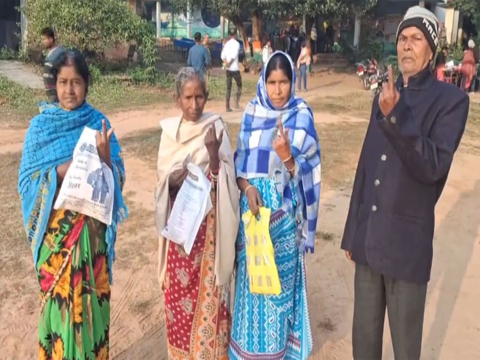 Voters display their inked fingers after casting their votes in Ghatsila Assembly by-election in Jamshedpur (Photo/ANI)