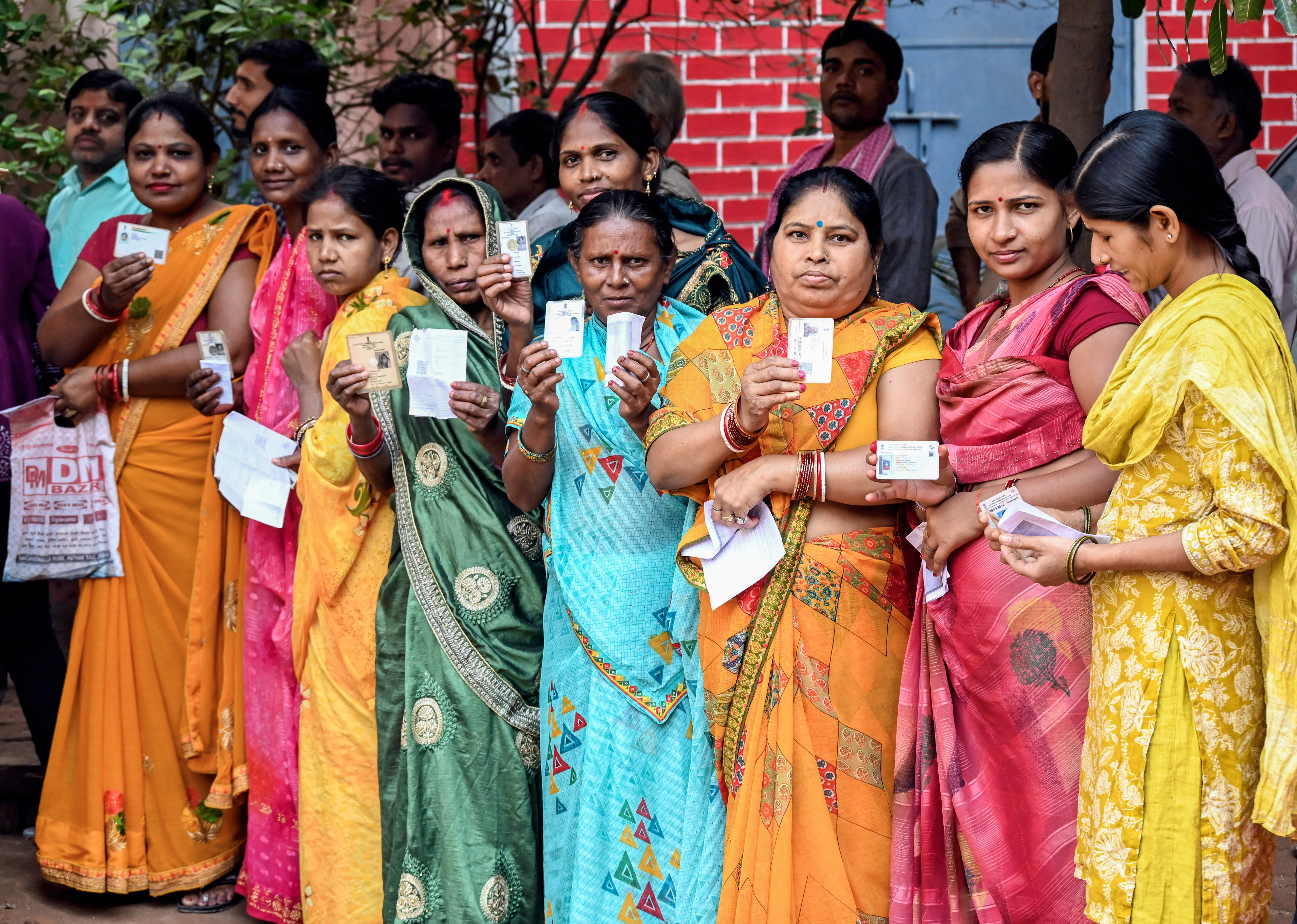 Women voters wait in a queue to cast their vote for the second phase of the Bihar assembly election, in Jahanabad Women voters wait in a queue to cast their vote for the second phase of the Bihar assembly election, in Jahanabad