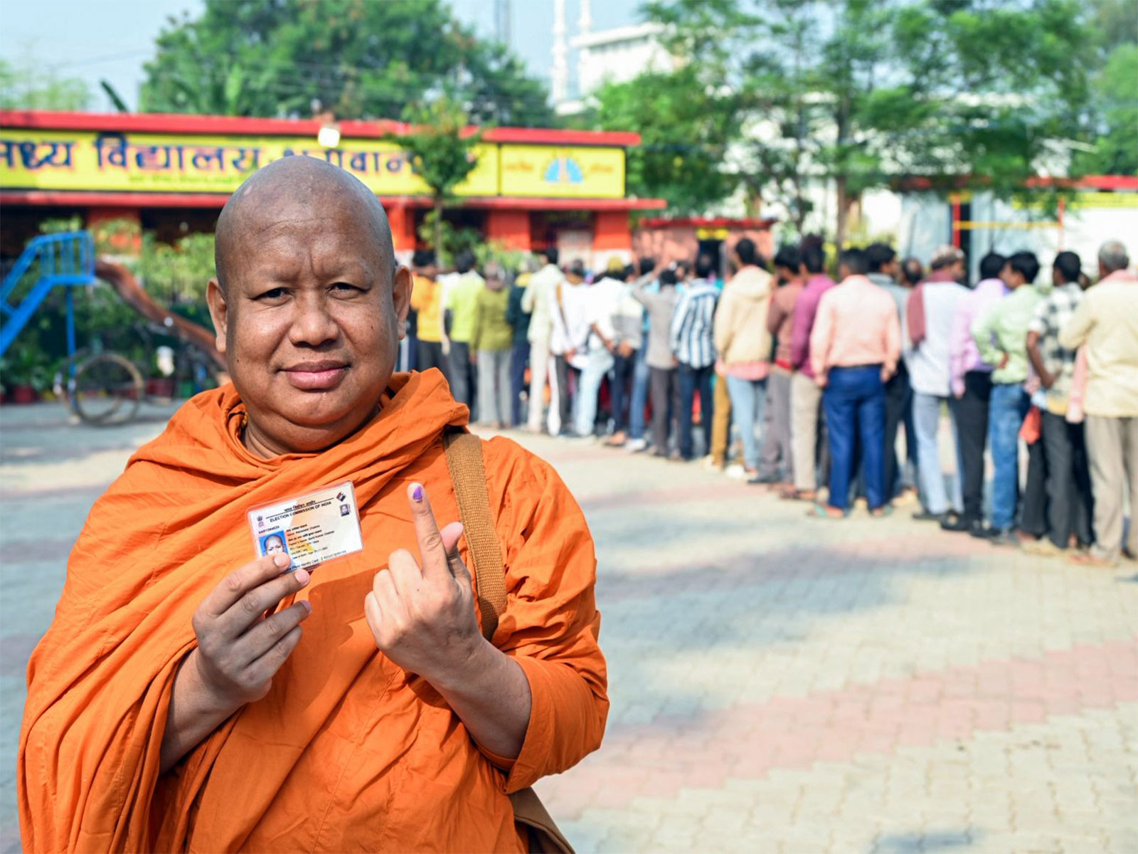 A monk shows his ink-marked finger after casting his vote in Gaya in the second phase of the Bihar assembly election (Photo/ANI)
