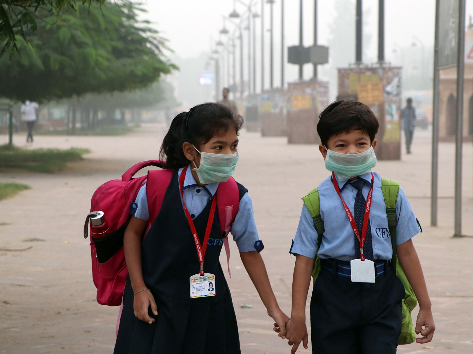 Two school students wearing a mask to protect themselves from pollution (File Photo/ANI)