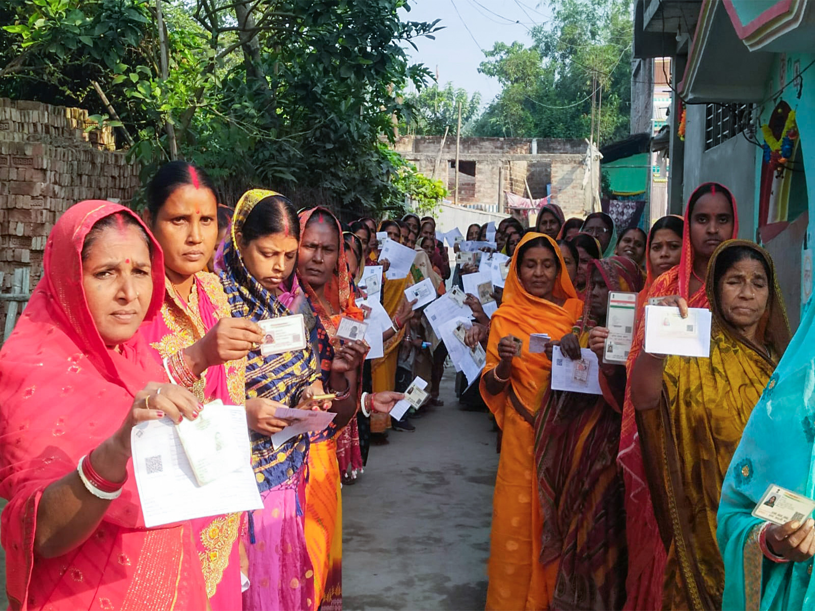 Women voters wait in a queue to cast their vote  in Katihar in the second phase of the Bihar assembly election (Photo/ANI)