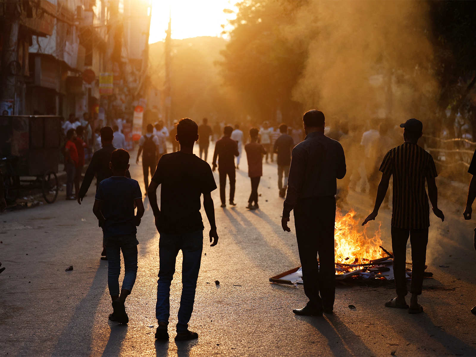 Anti-Hasina demonstrators set fire on a street during a clash, after the verdict on cases against the ousted Prime Minister Sheikh Hasina, in Dhaka (Photo/Reuters)