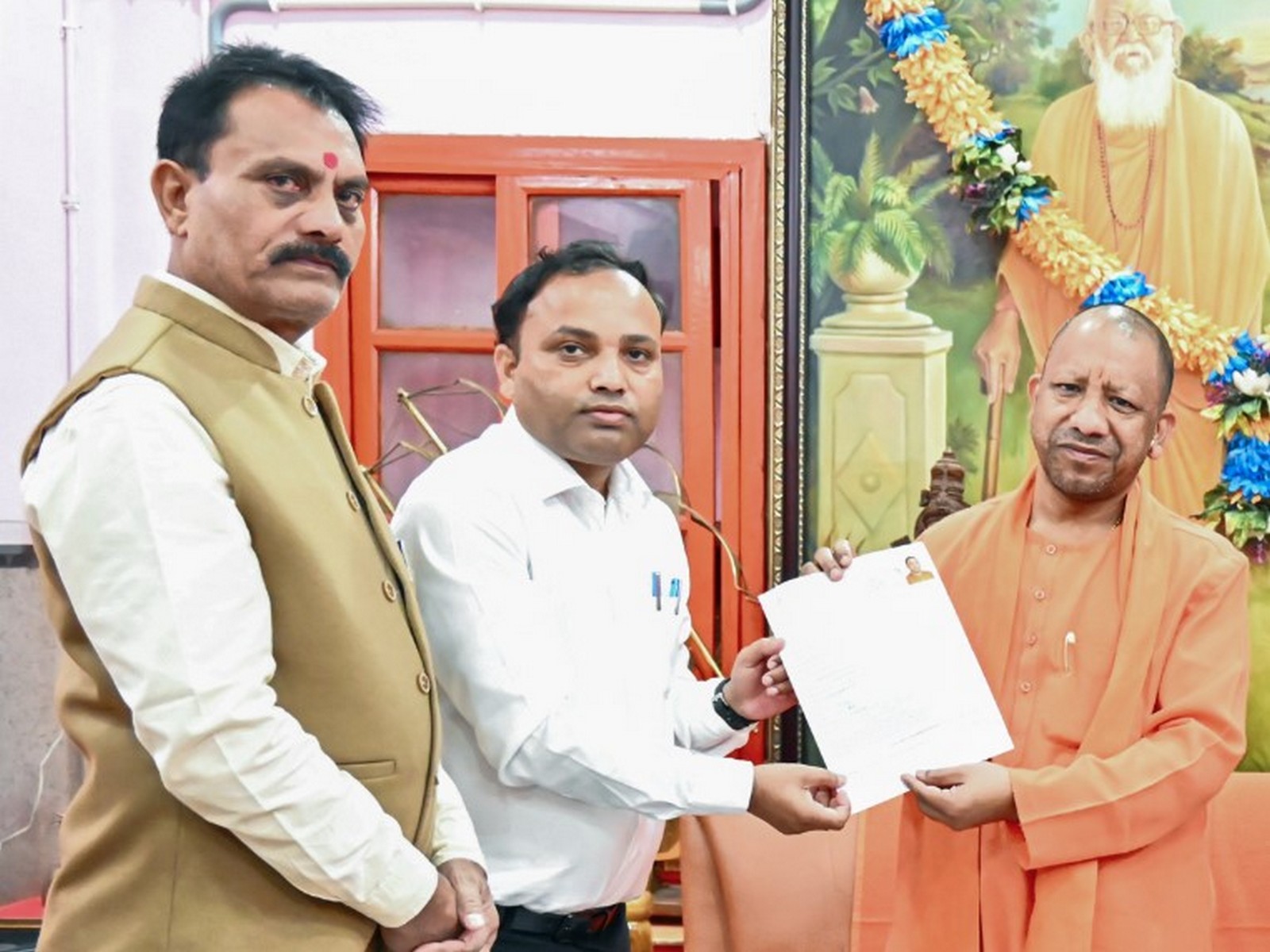 Uttar Pradesh CM Yogi Adityanath fills enumeration form under Special Intensive Revision (Photo/ANI)
