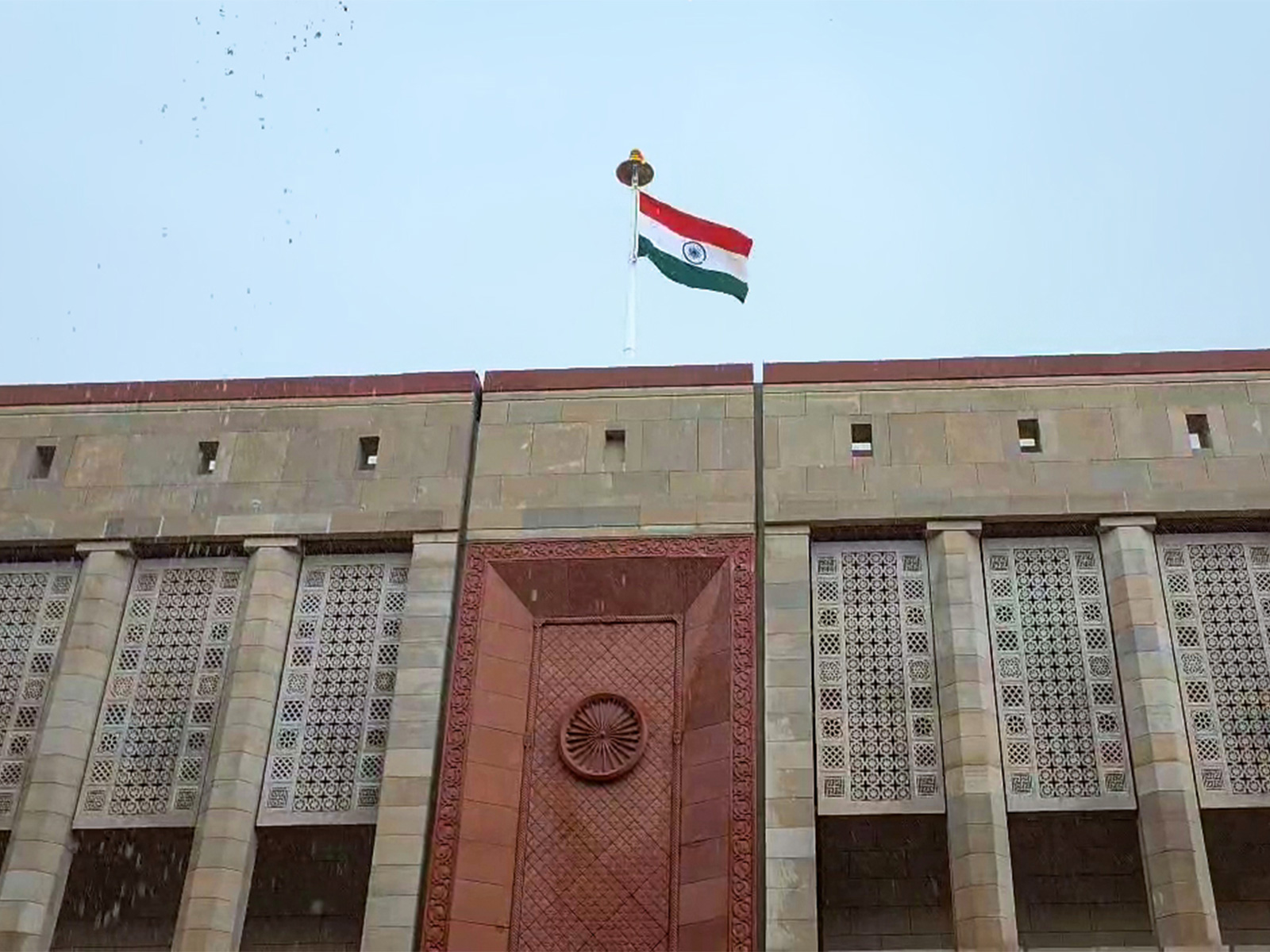 A view of the National flag over the Parliament House building (File Photo/ANI)
