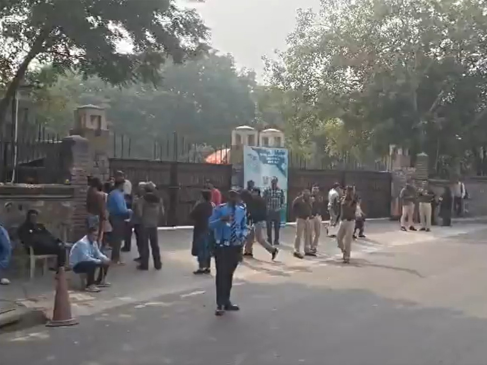 Delhi police officials outside a school in Chanakayapuri (Photo/ANI)