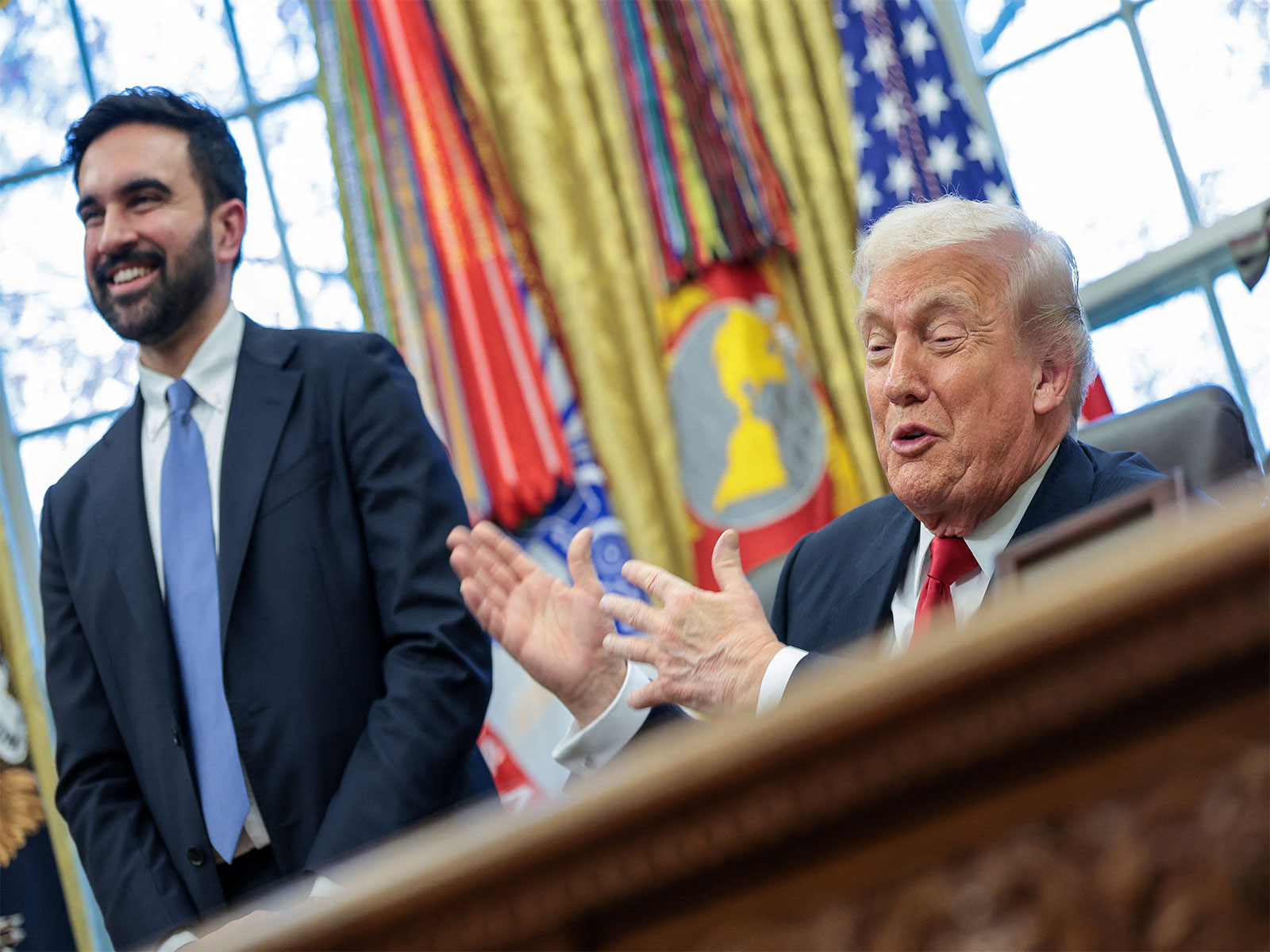 US President Donald Trump and New York City Mayor-elect Zohran Mamdani react as they speak to members of the media in the Oval Office (Photo/Reuters)