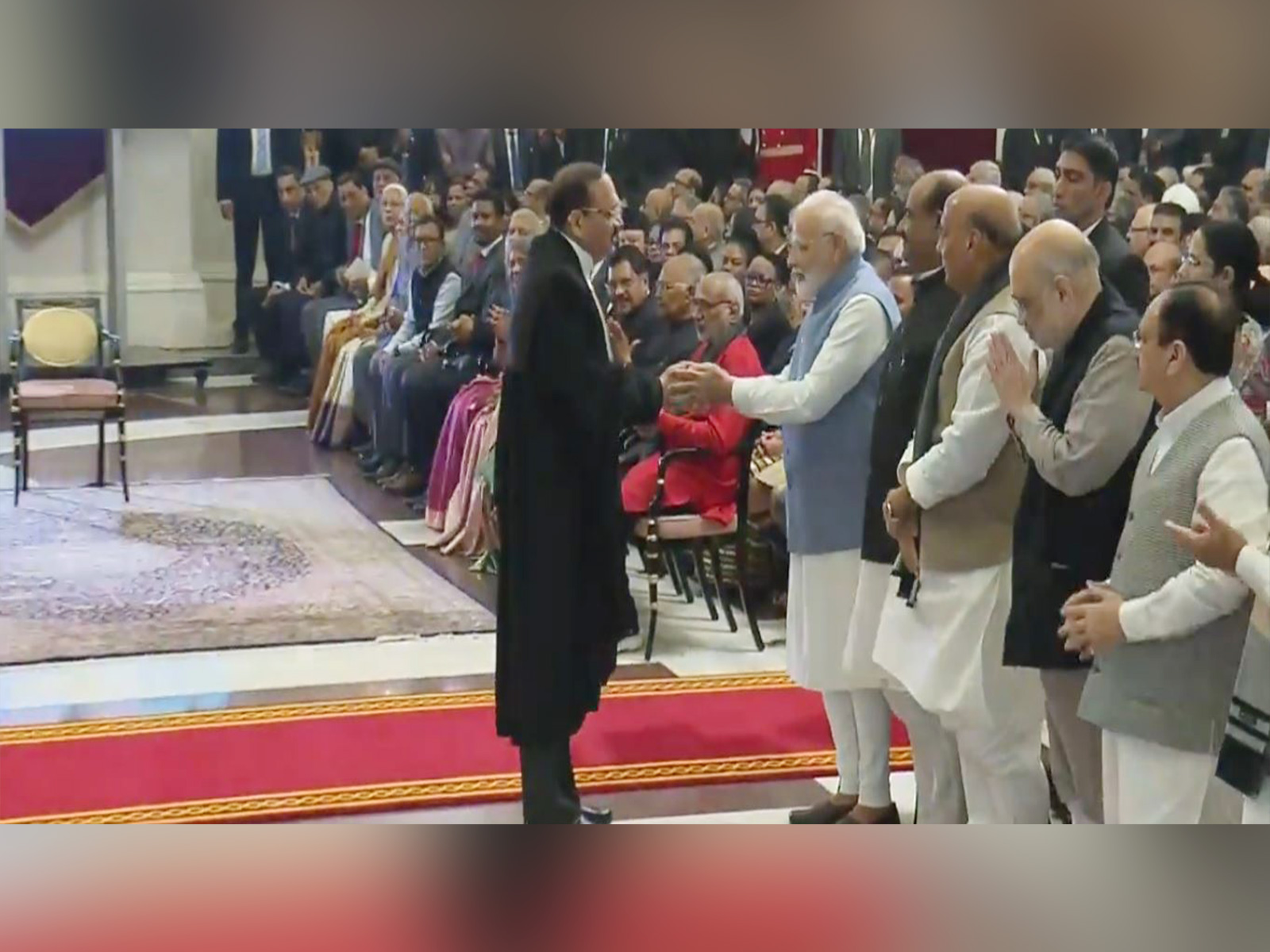 Chief Justice Surya Kant (left) shakes hands with Prime Minister Narendra Modi (Photo/X @rashtrapatibhvn)