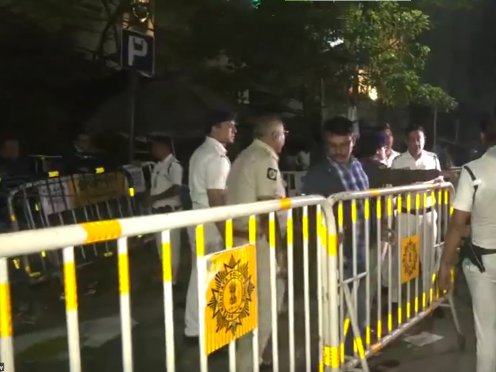 Police set up barricades outside the office as demonstrators surrounded the main gate, demanding clarity on the SIR process (Photo/ANI)