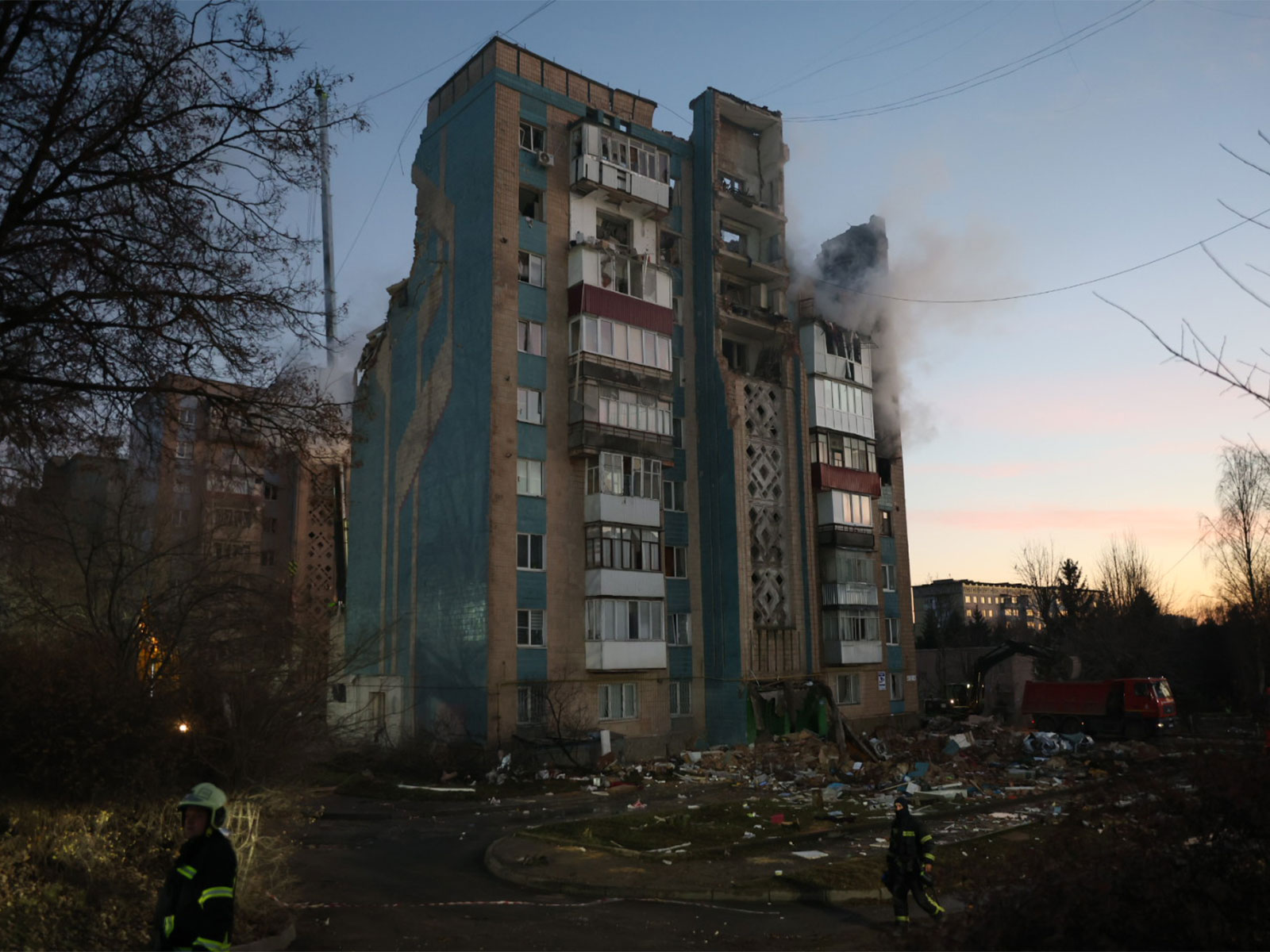 A damaged residential building smoulders after a Russian strike, with firefighters working amid debris in a neighbourhood hit during the latest attack in Ukraine. (Photo: X/@ZelenskyyUa)