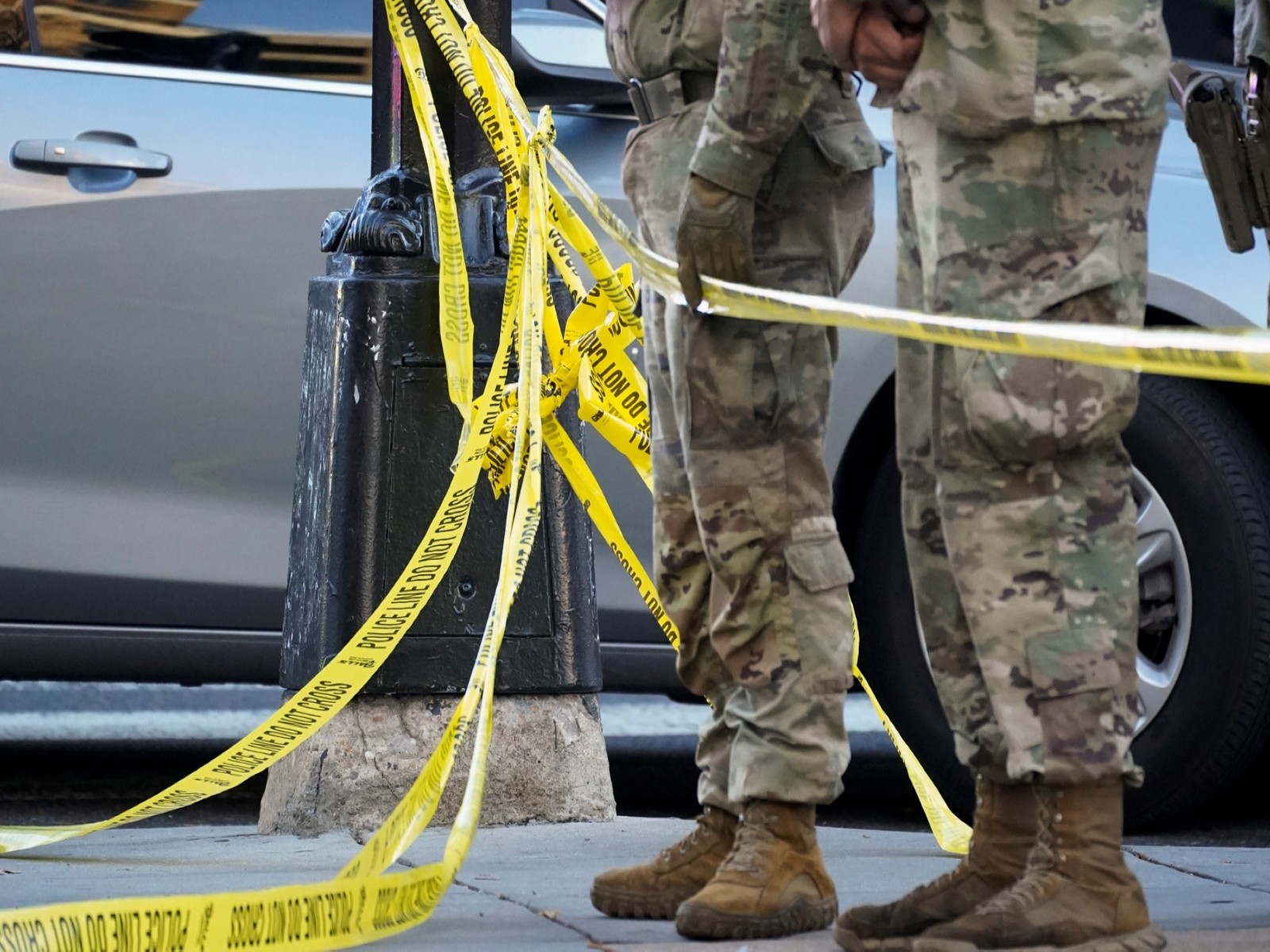 National Guard personnel stand behind yellow tape after two were shot near White House (Photo/Reuters)