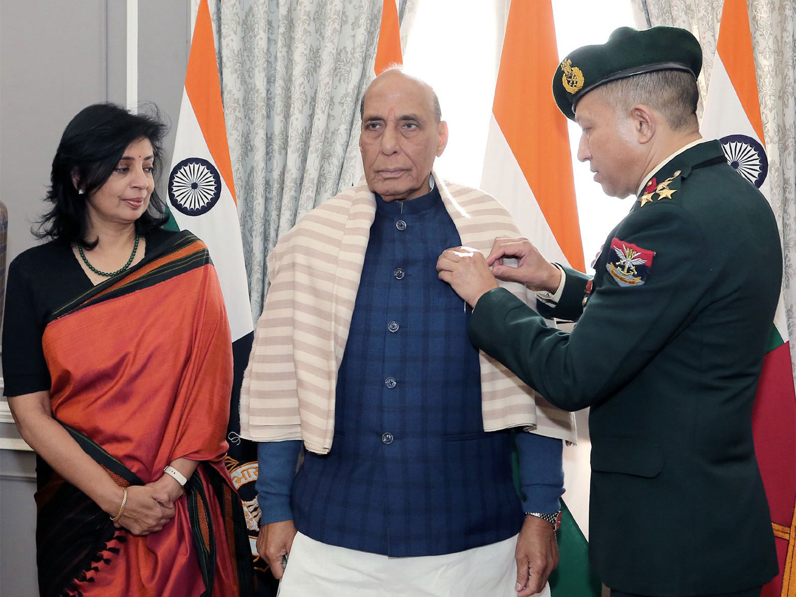 Defence Minister Rajnath Singh being pinned the Armed Forces Flag pin (Photo/X @rajnathsingh)