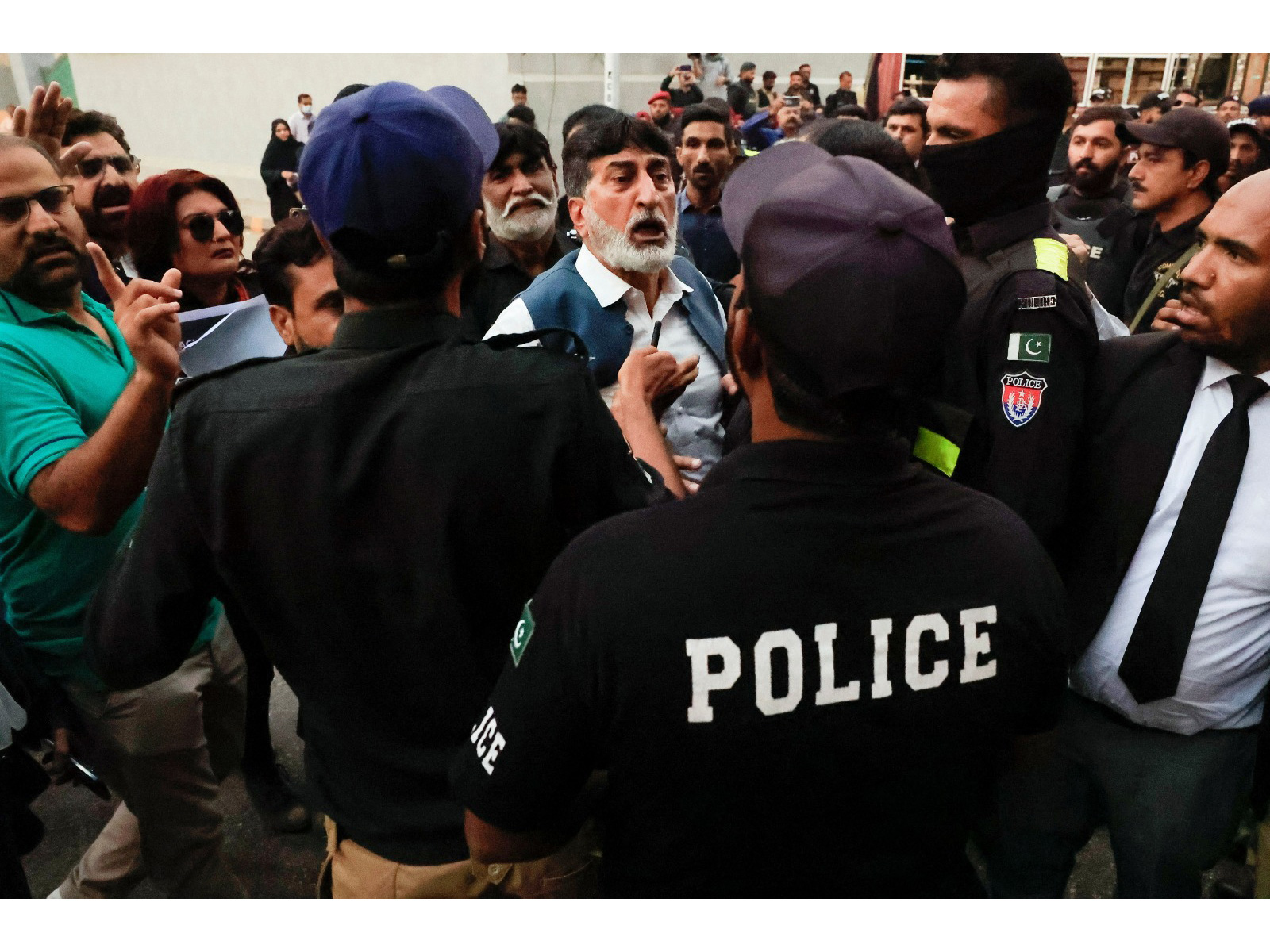 Police officers try to stop lawyers participating in an anti-government protest in Karachi in November (Photo/ Reuters)