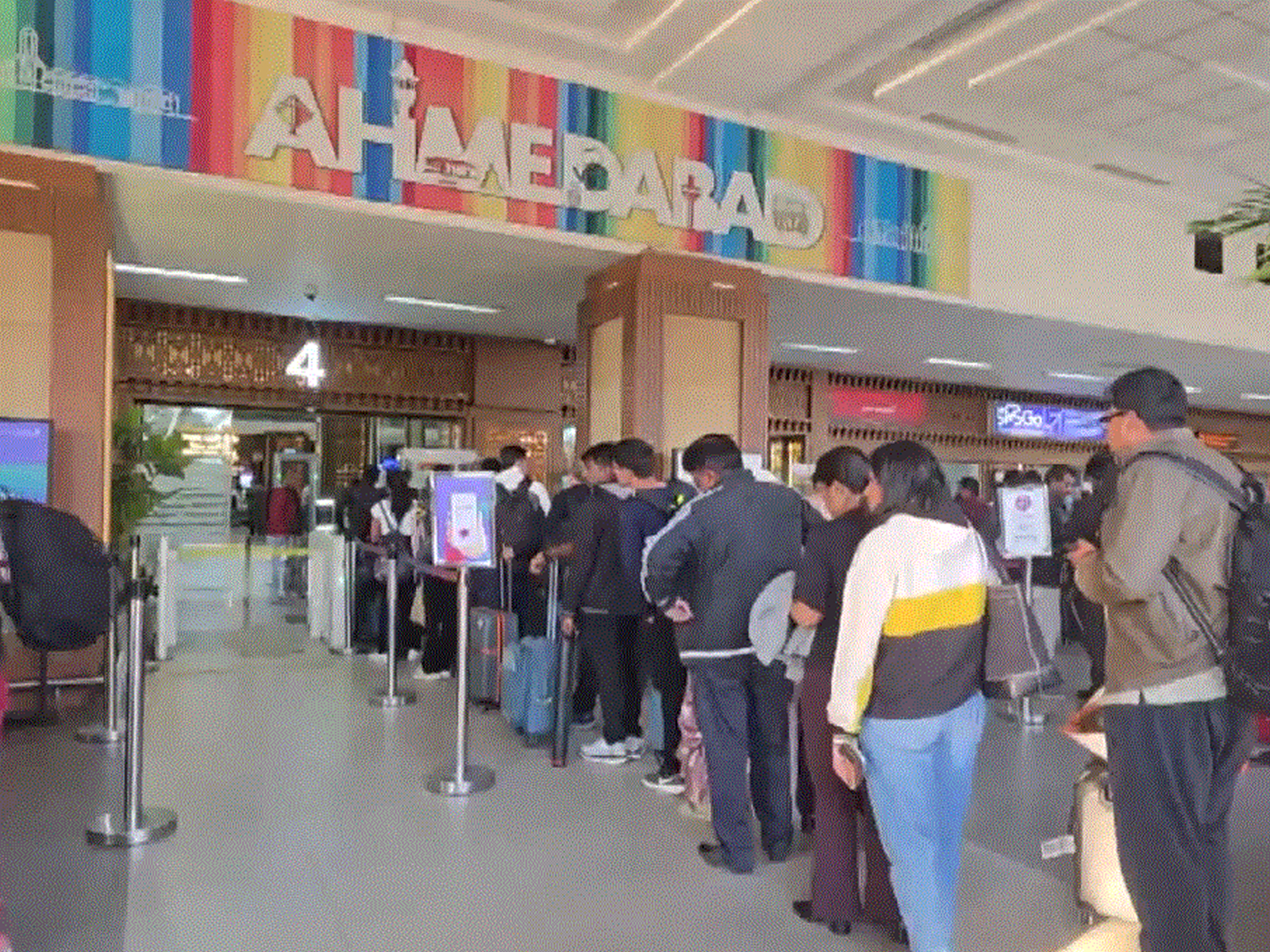 People standing in a queue at Sardar Vallabhbhai Patel International Airport in Ahmedabad, Gujarat (Photo/ANI)