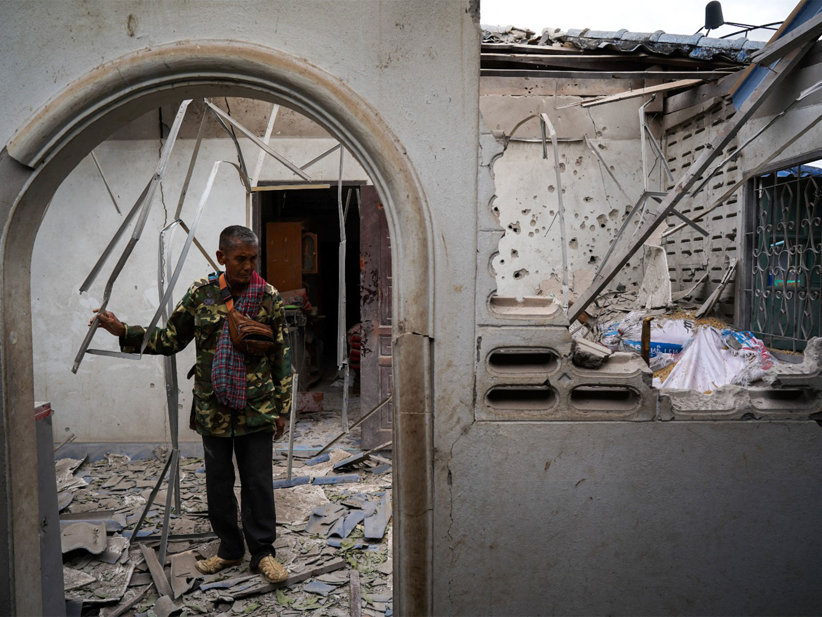 A man inside his damaged house amid deadly clashes between Thailand and Cambodia (Photo/ Reuters)