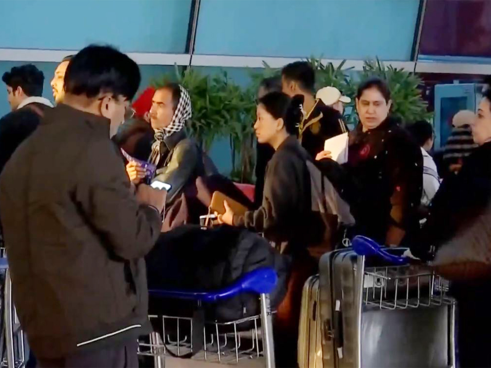 Passengers standing in queue inside the Indira Gandhi International (IGI) Airport in Delhi (File Photo/ANI)