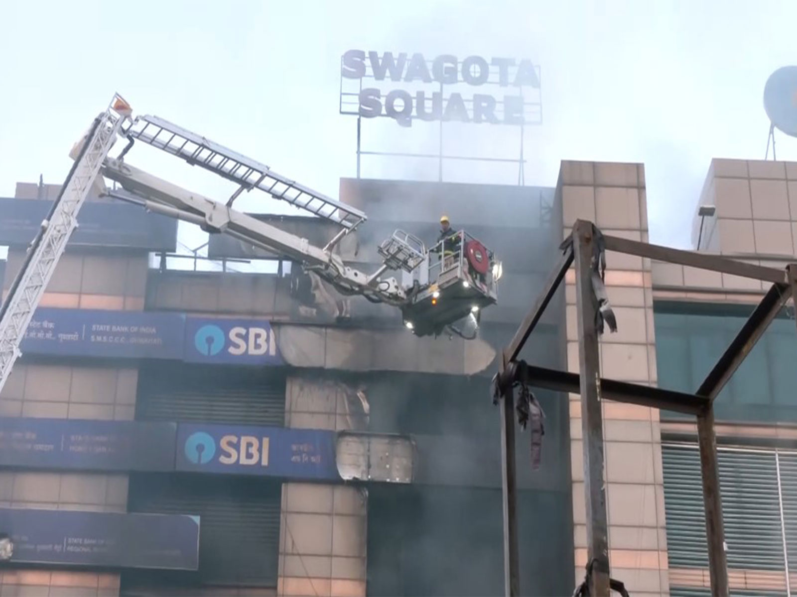 Firefighters dousing fire at 'Sohum Emporia' shopping complex in Guwahati (Photo/ANI)