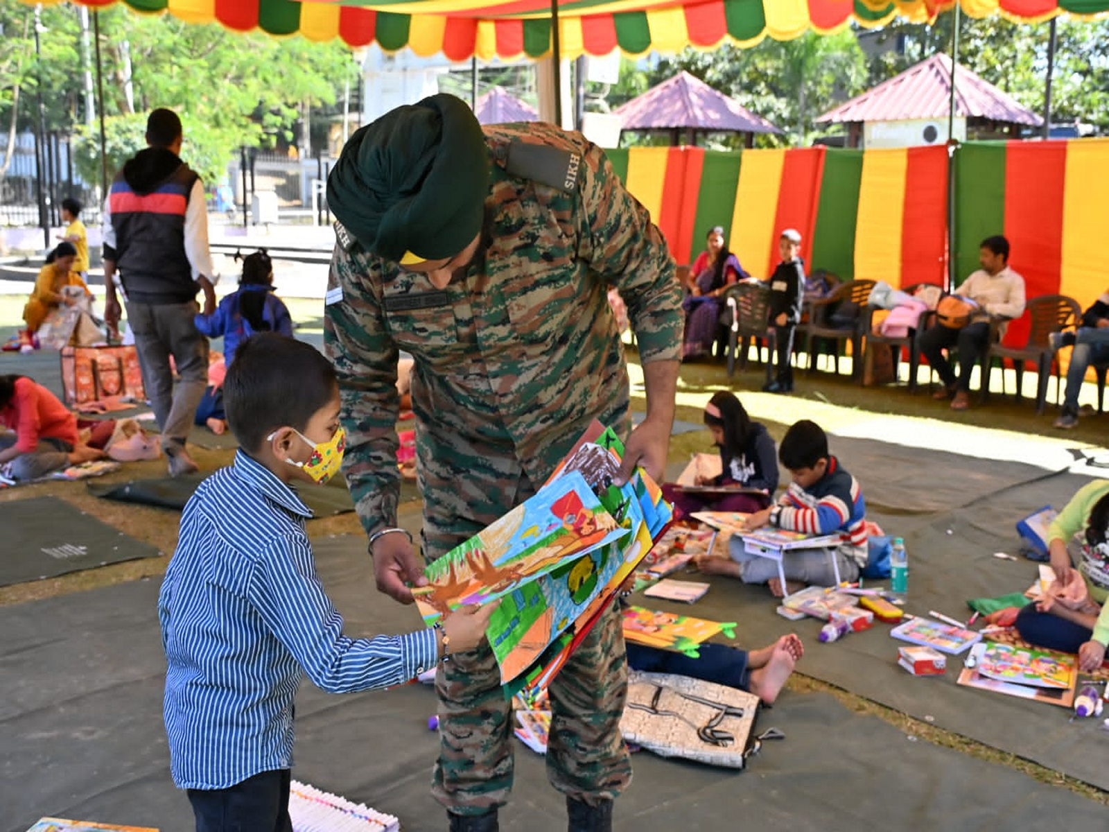 Indian army personnel with a kid during Vijay Diwas celebrations in Agartala on Sunday. (Photo/Army HQ, Shalbagan, Agartala)