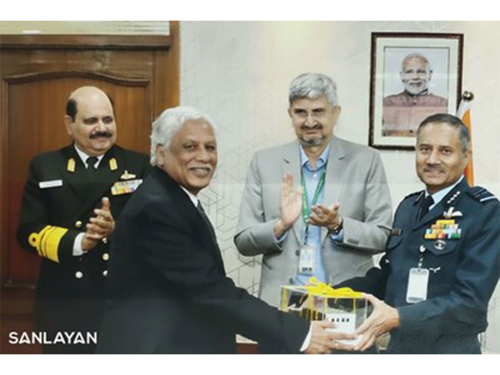 R. Chandra Kumar, CEO of Versabyte (a Sanlayan Company) hands technology to Air Marshal Awdhesh Kumar Bharti, in the presence of DRDO Chairman Samir V. Kamat and Vice Admiral Vineet McCarthy