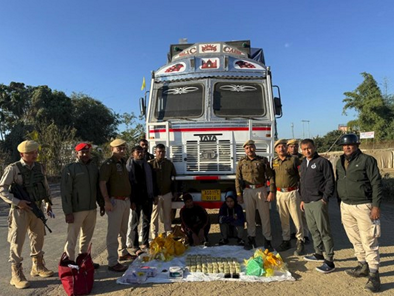 Assam Police with seized Yaba tablets and arrested criminals in Cachar, Assam on Monday. (Photo/ANI)
