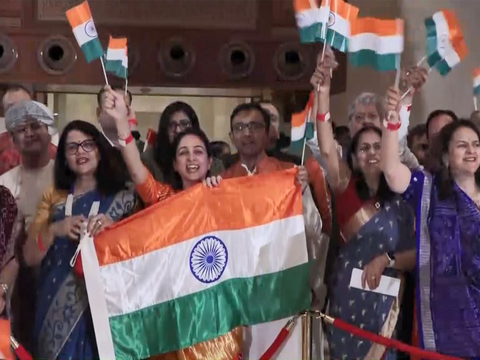 Indian diaspora members in Muscat chant slogans as Prime Minister Narendra Modi arrives for the final leg of his three-nation visit (Photo/ANI)